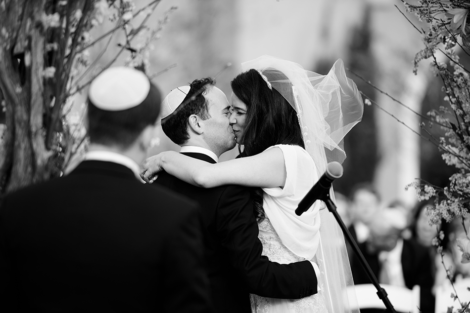 bride and groom first kiss