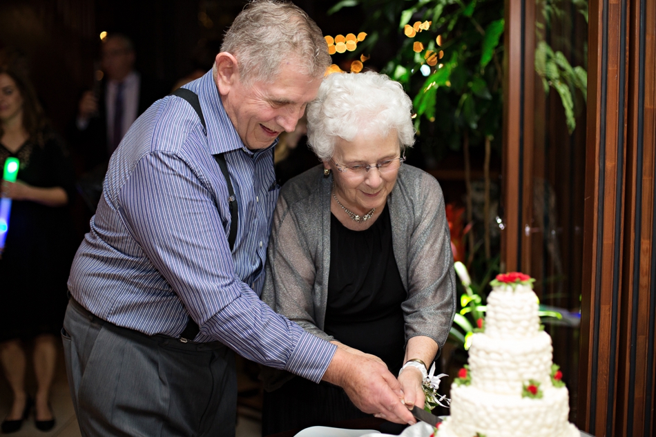 grandparents cut wedding cake