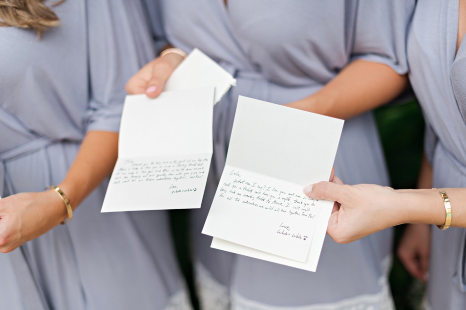 groom writes notes to bridesmaids