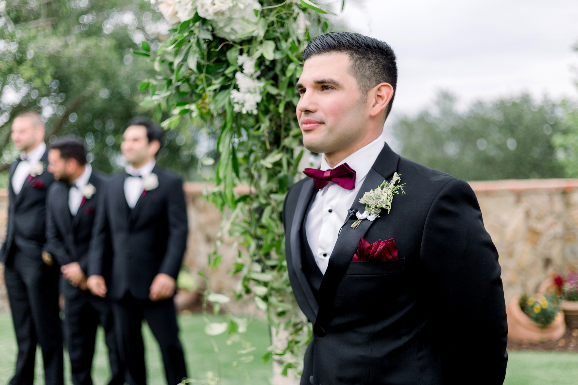 groom sees bride walking down the aisle