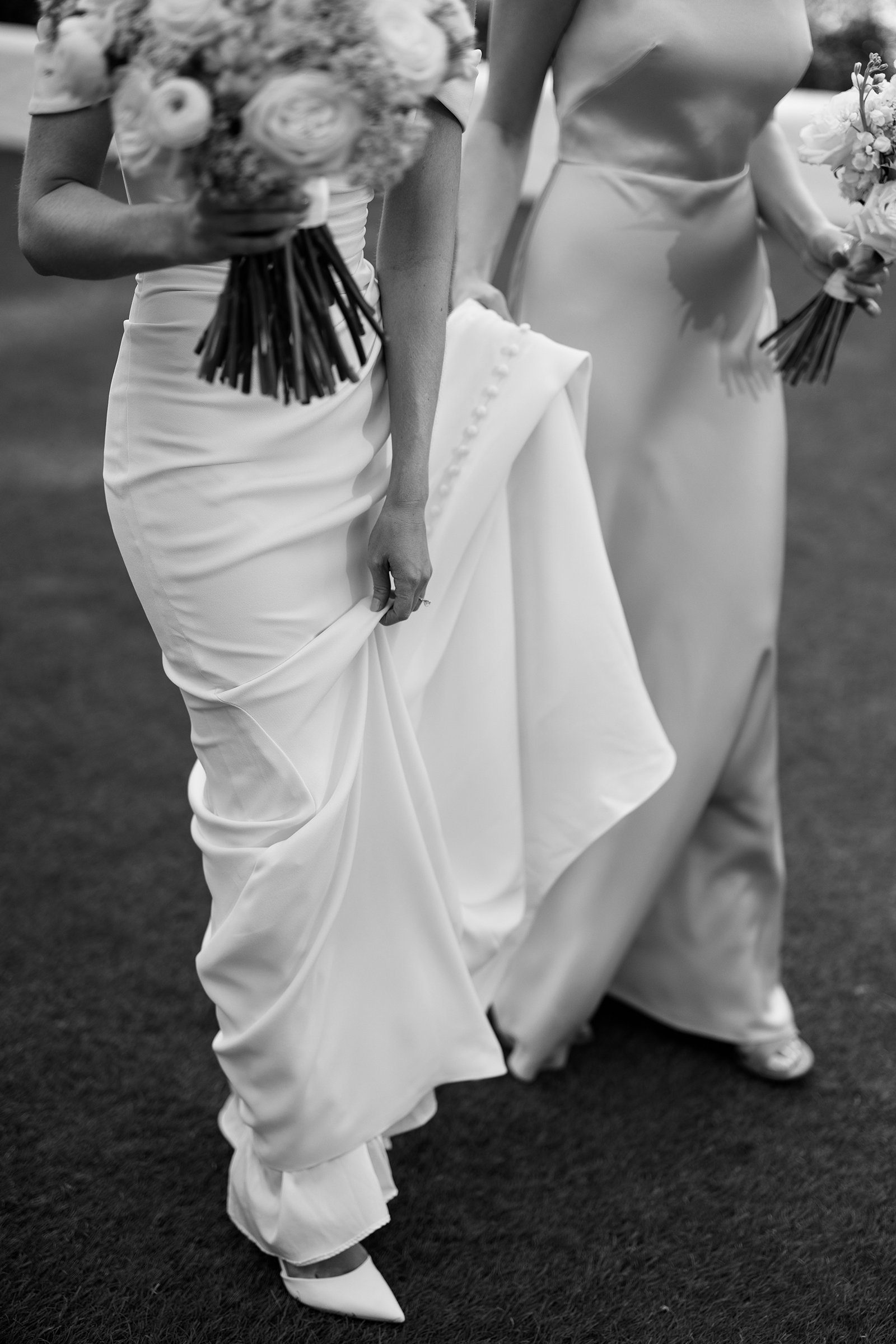 black and white candid portrait of bride and bridesmaids