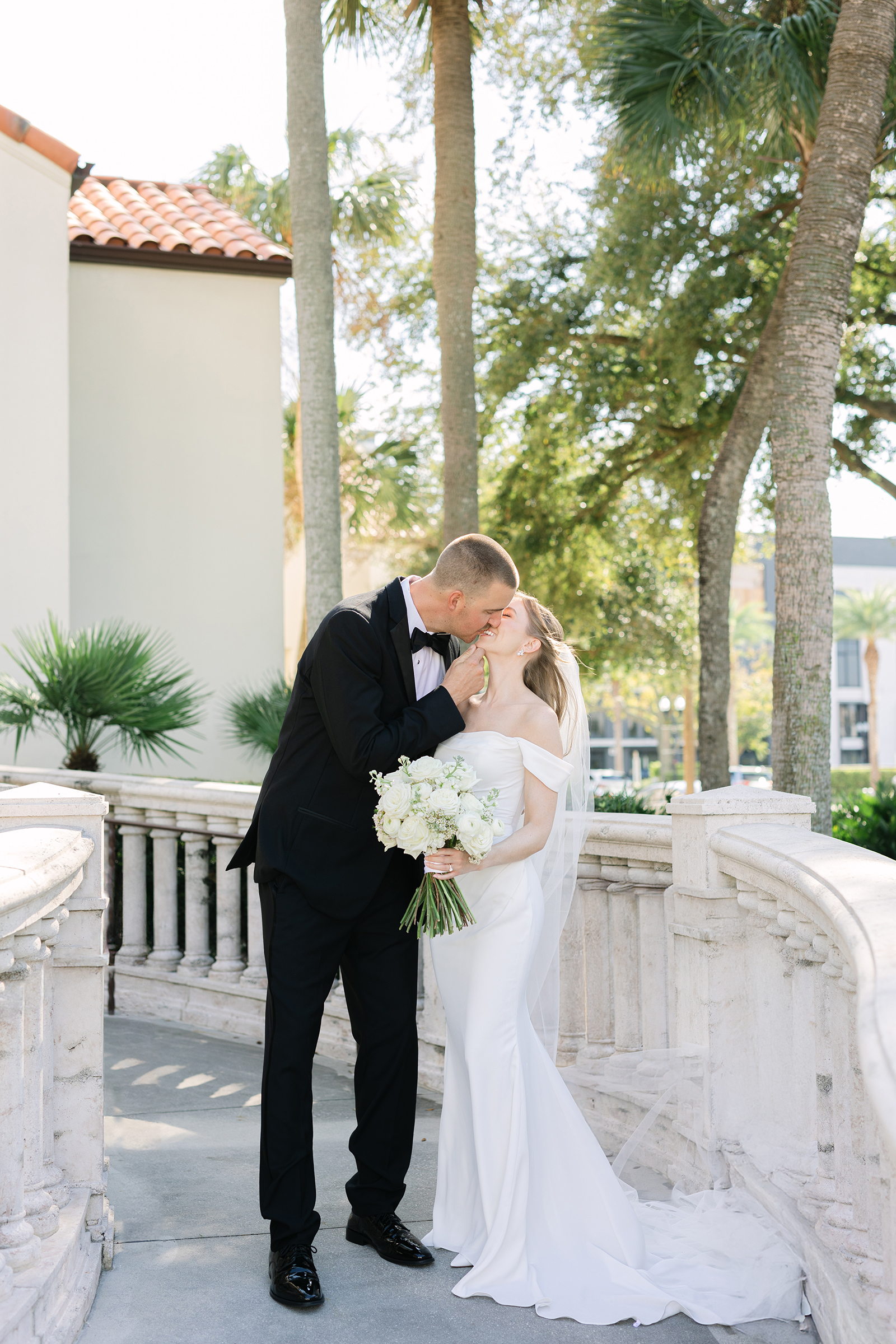 bright outdoor portraits of bride and groom at St. James Cathedral