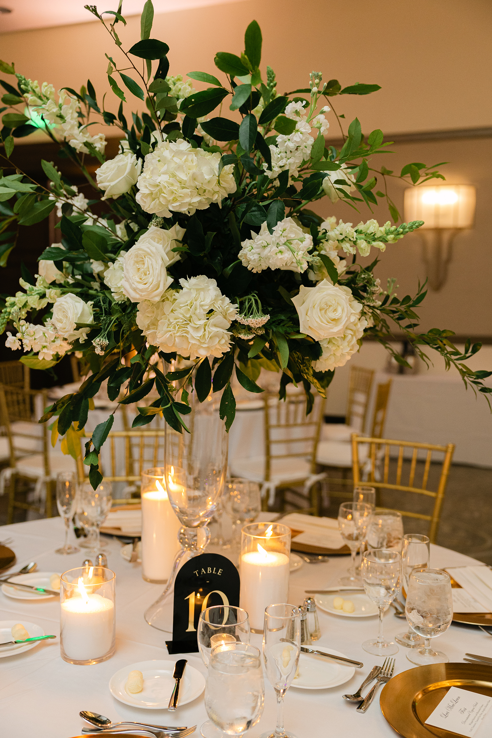 white bouquet for wedding reception and table details