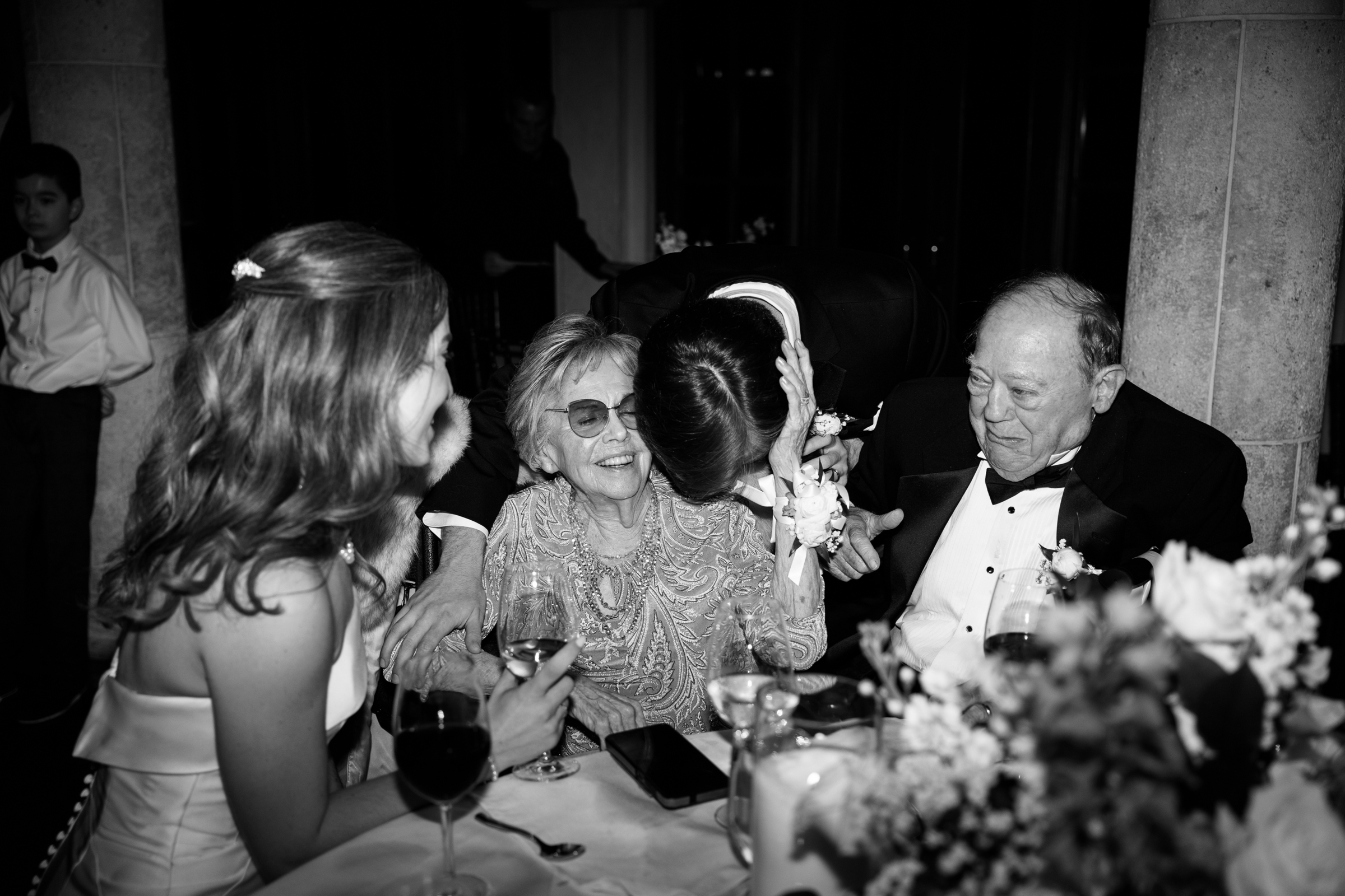 black and white picture of guests during the wedding ceremony