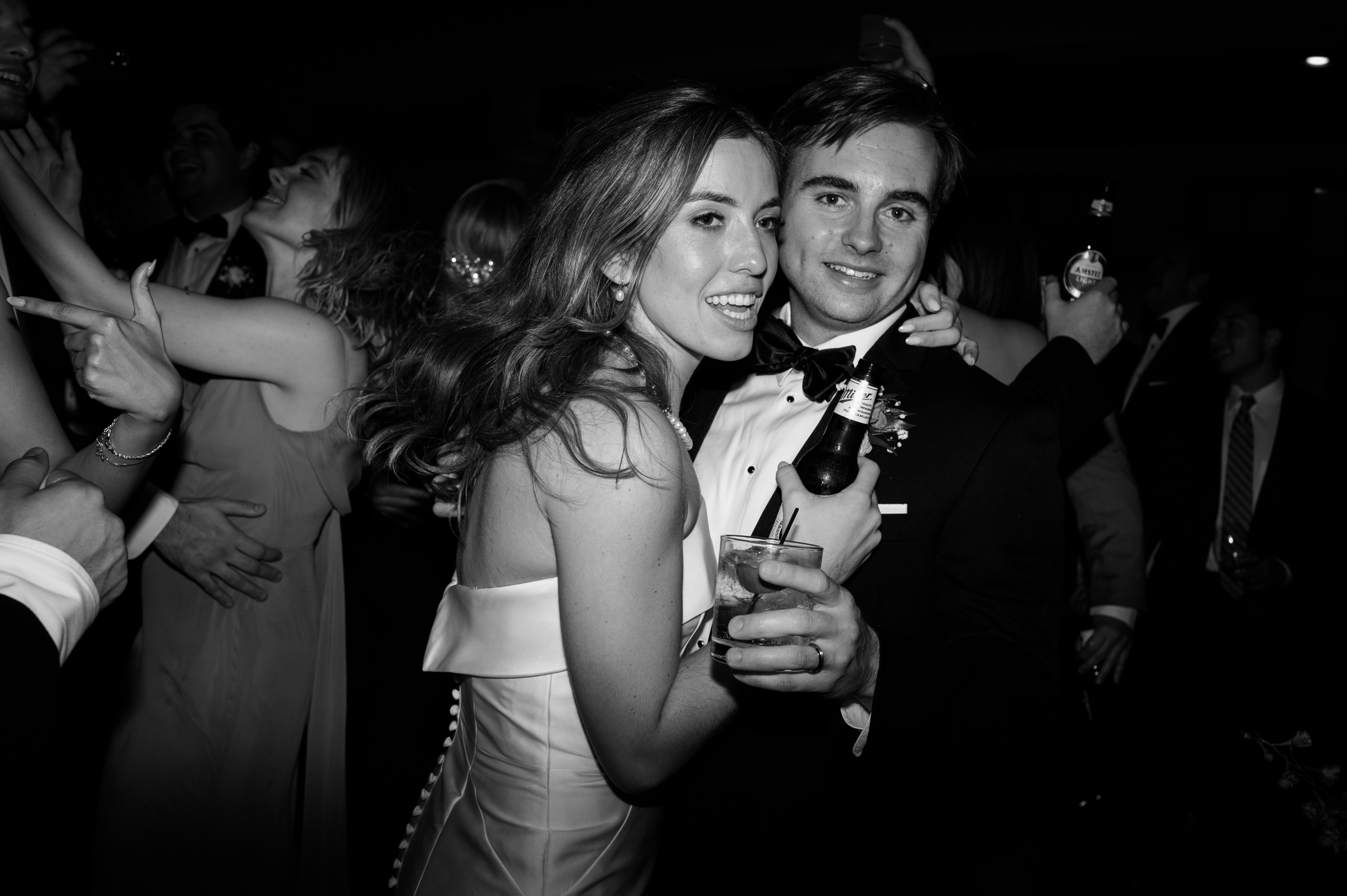 black and white picture of bride and groom during reception