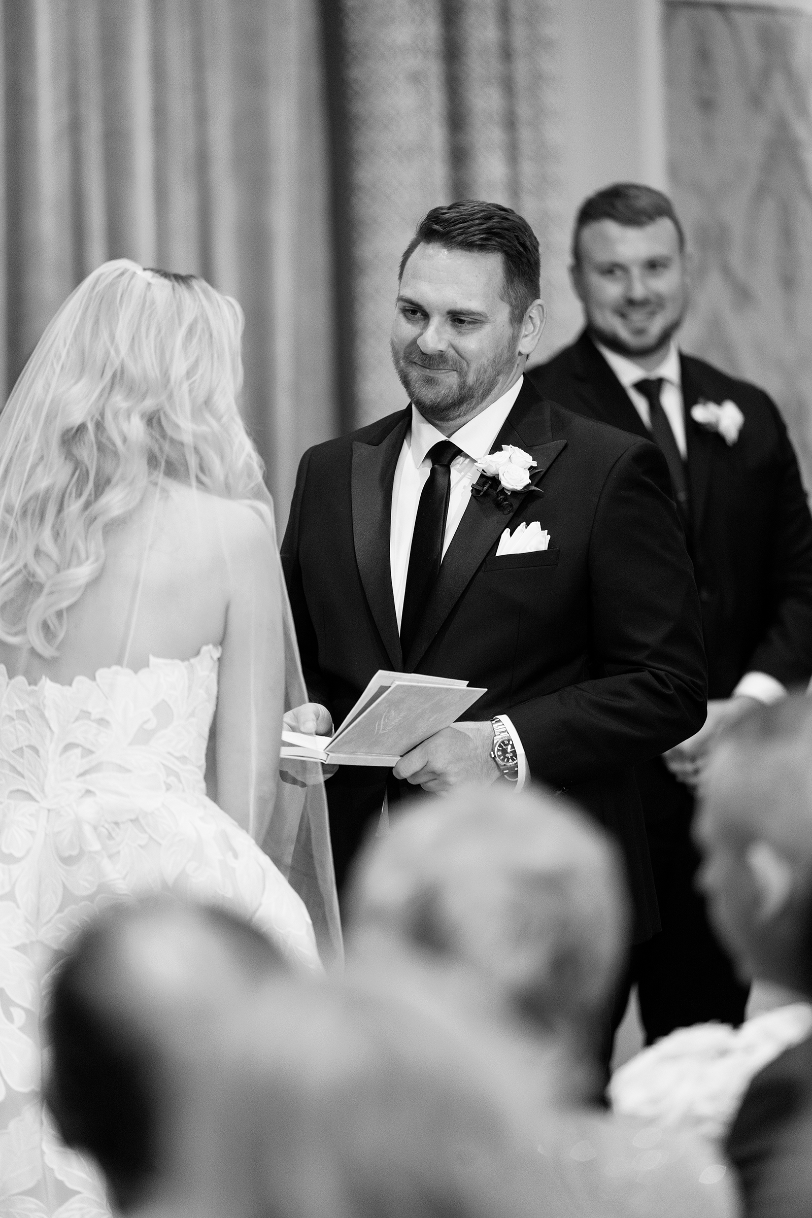 groom saying vows at alter