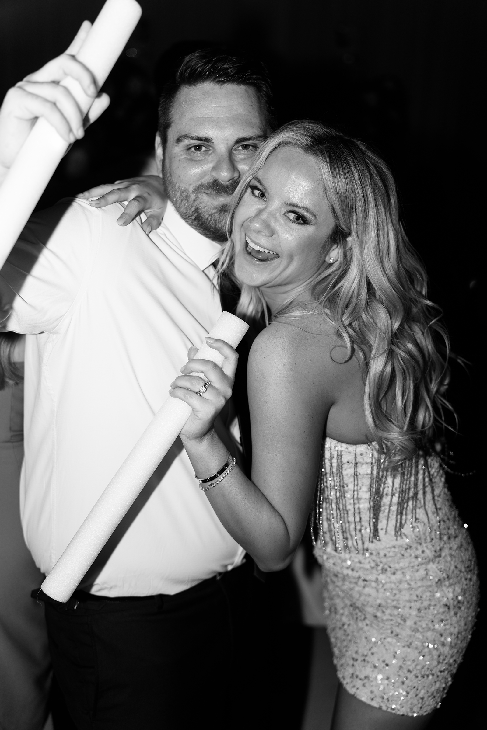 black and white picture of bride and groom during wedding reception