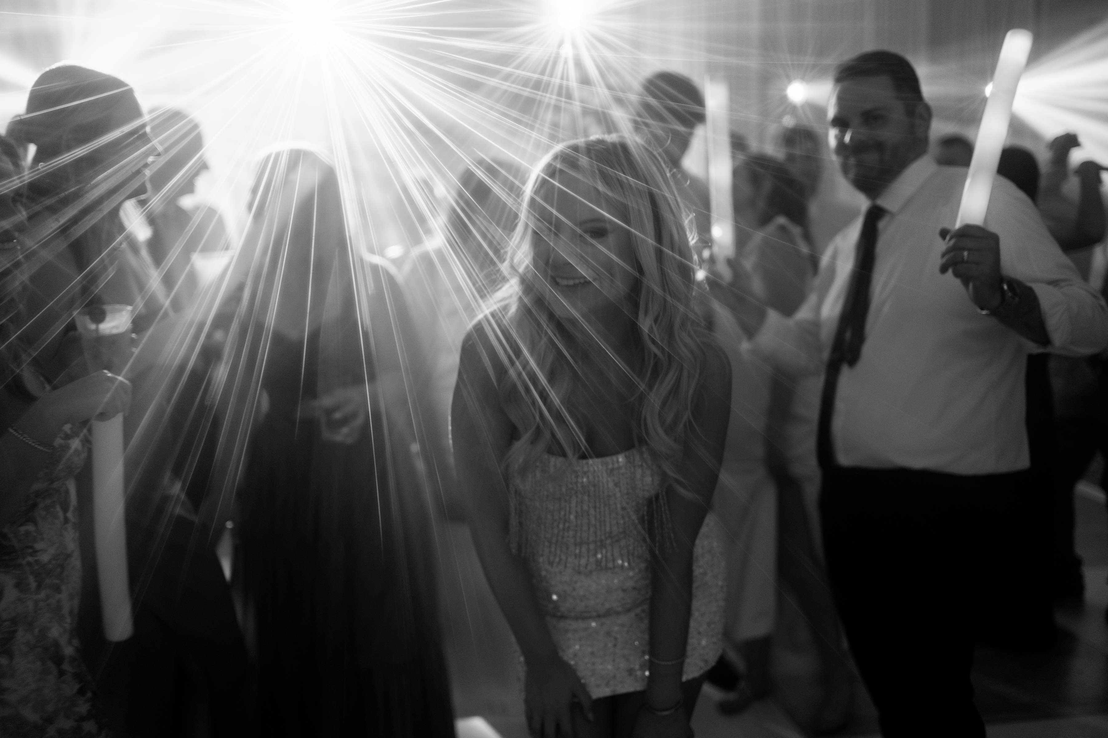 black and white picture of fluorescent lights during wedding reception