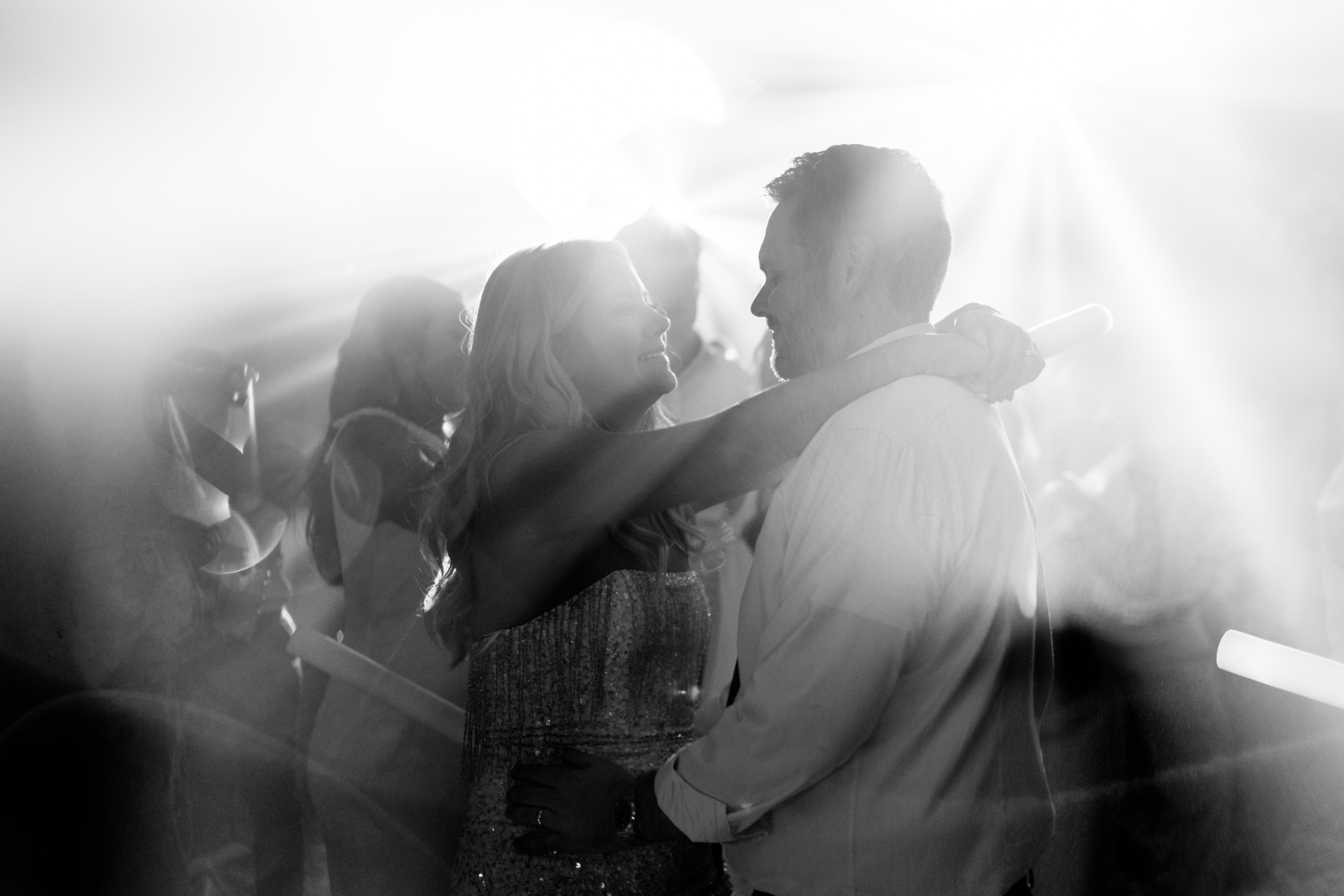 black and white dreamy picture of bride and groom during wedding reception
