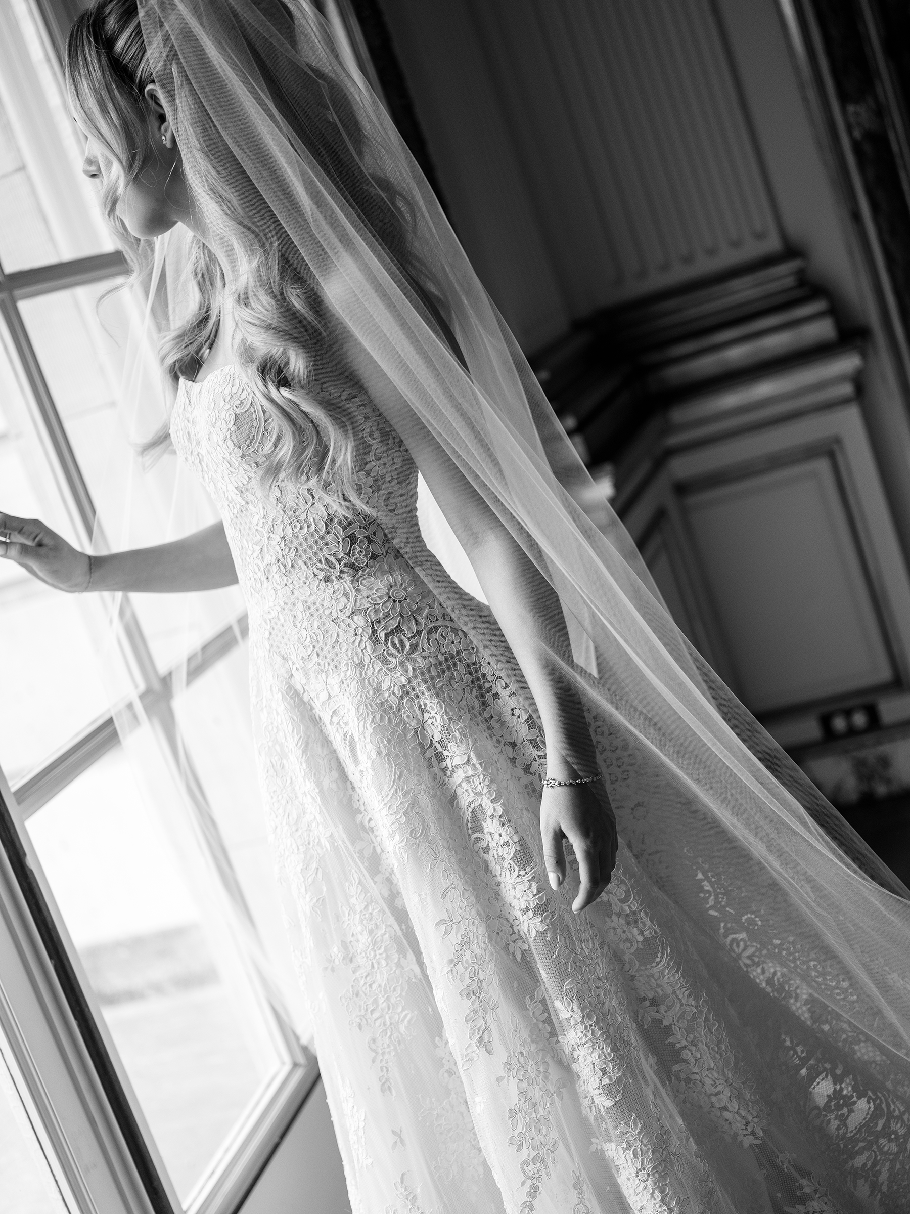 black-and-white picture of bride with corset lace top dress