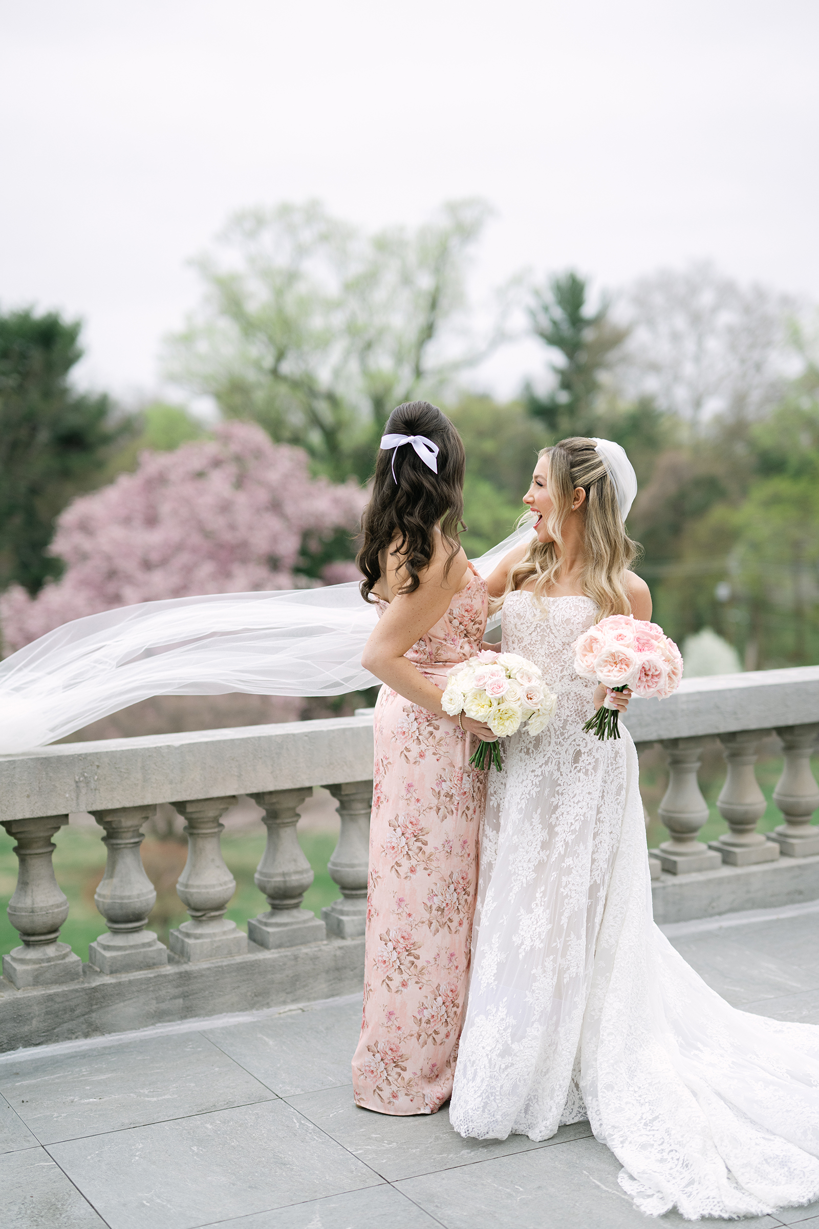 bride with bridesmaid dressed in blush pink