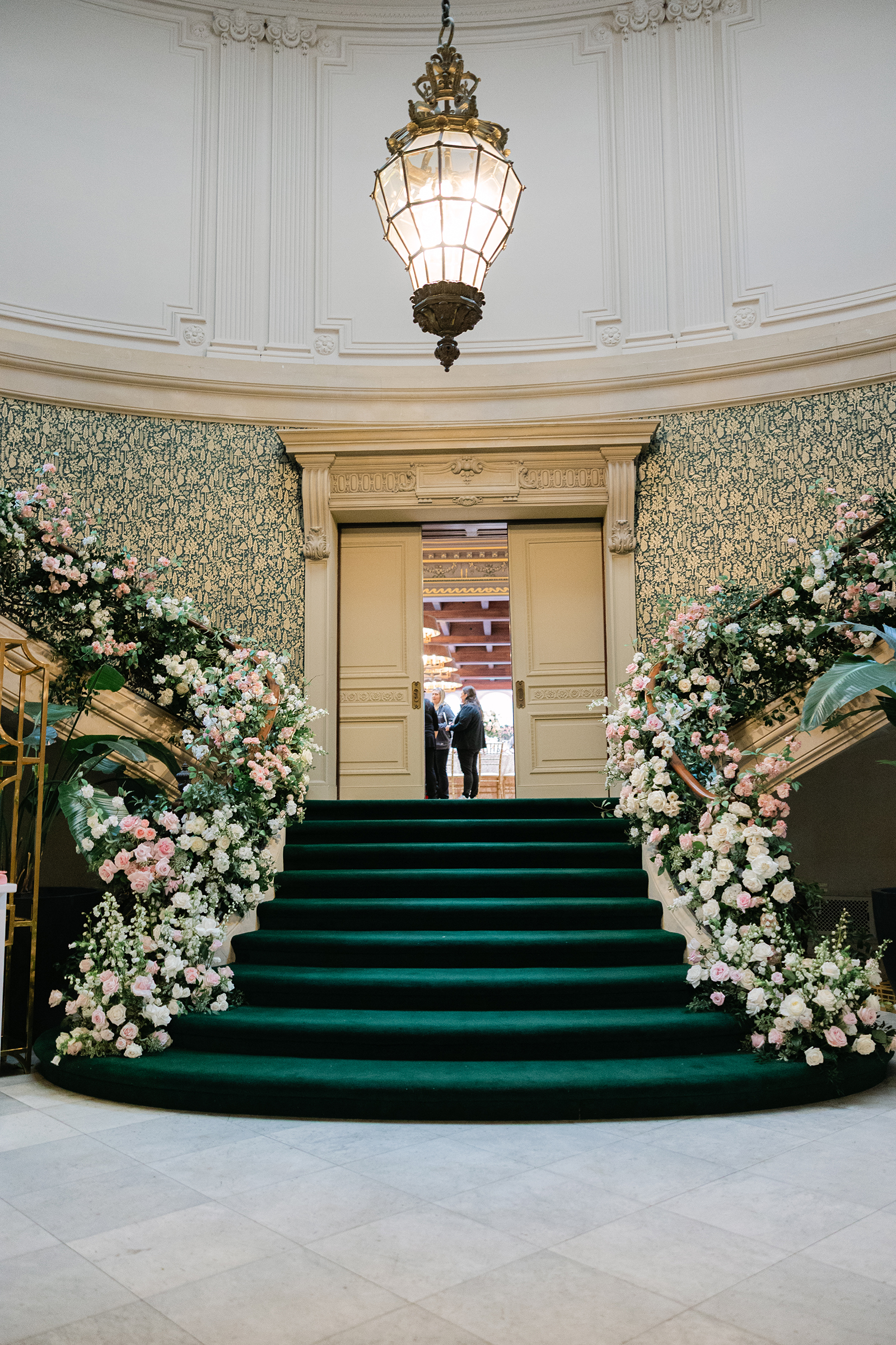 entryway staircase lined with florals