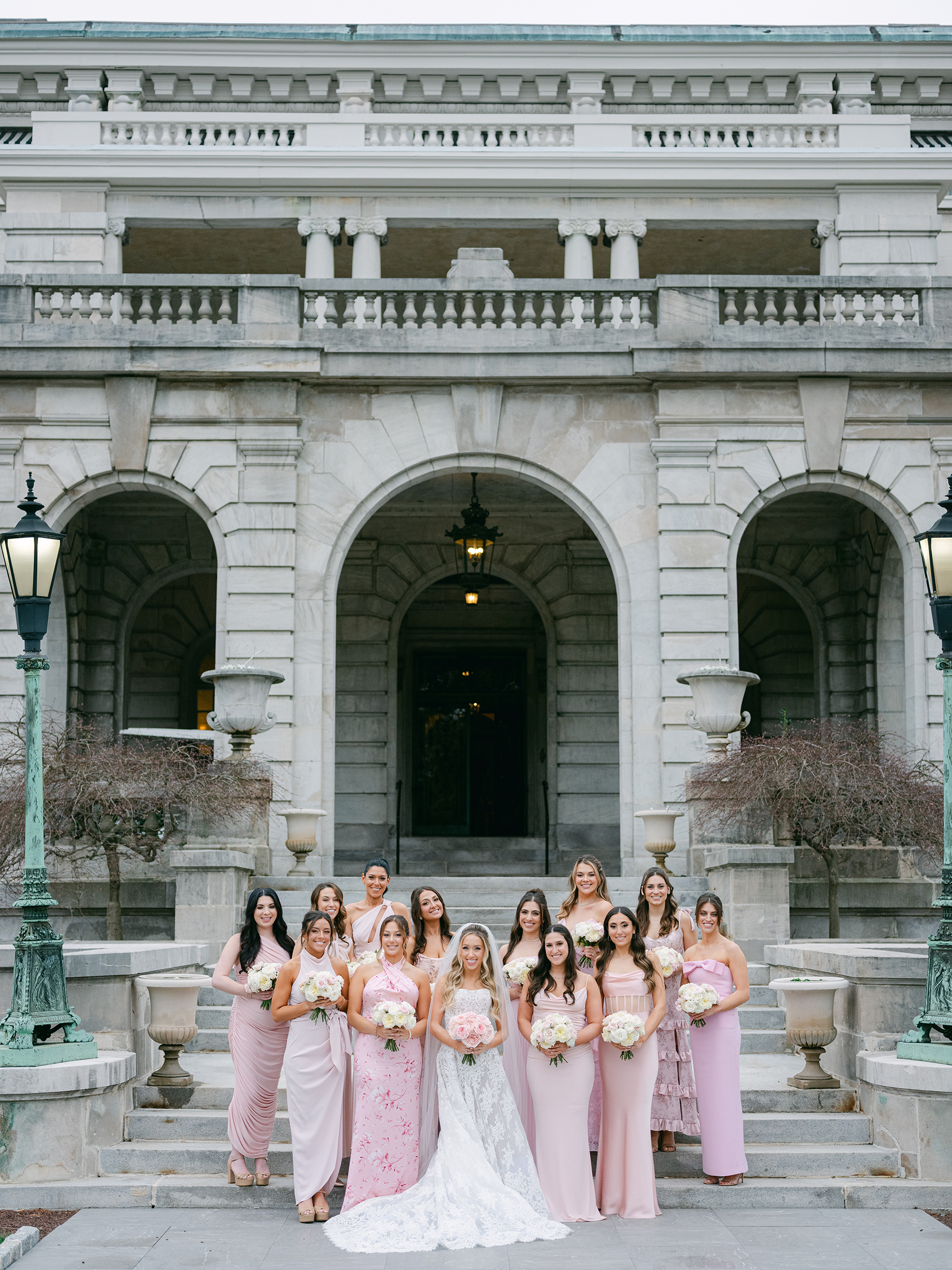 bride with bridesmaids in blush and light pink dresses