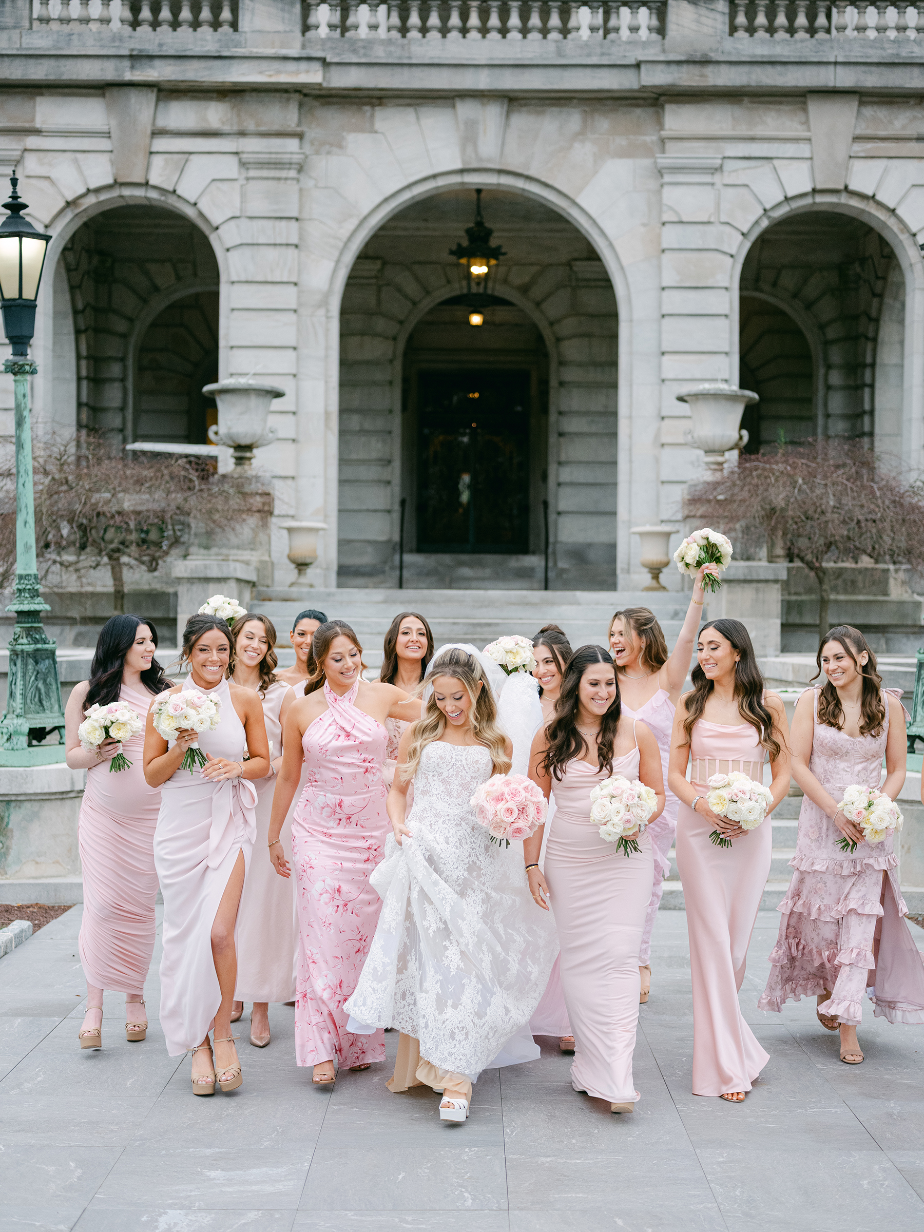 bride with bridesmaids in blush and light pink dresses