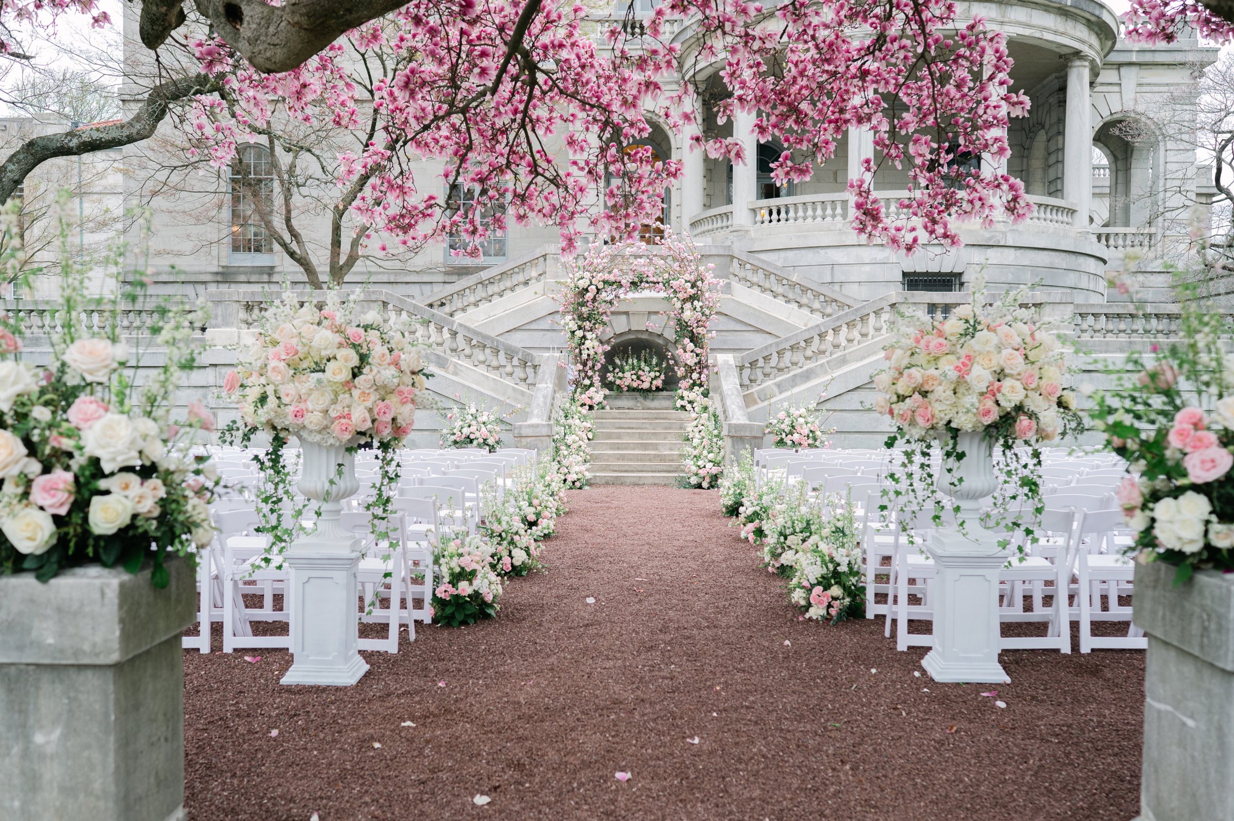 cherry blossoms and pink and white florals at wedding ceremony