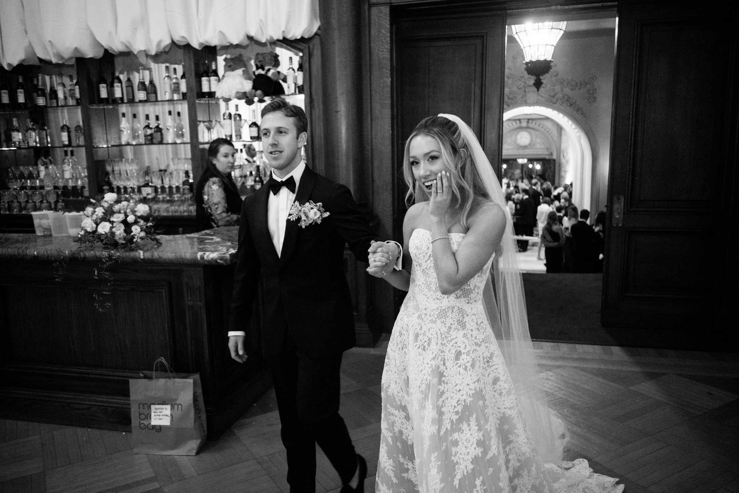 bride and groom entering the reception room