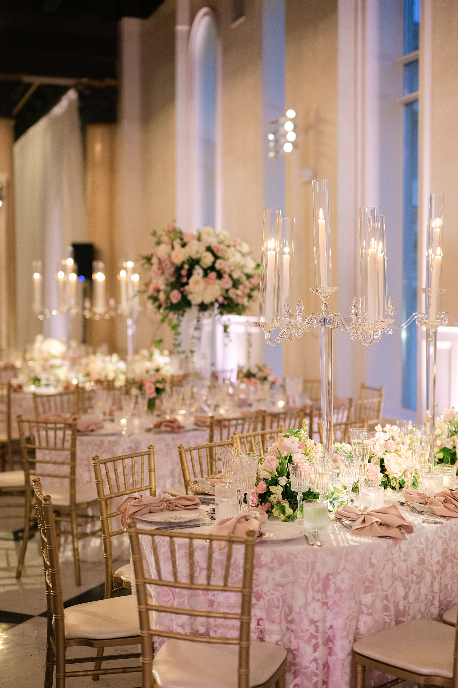 wedding reception with candlelights and pink with gold accent color scheme
