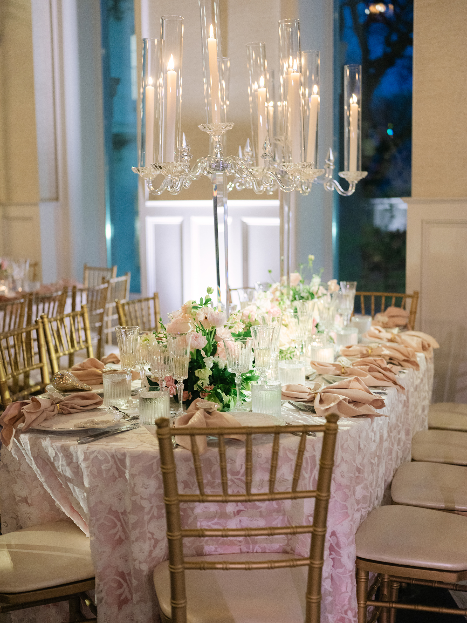 pink and white wedding reception decor with gold accents