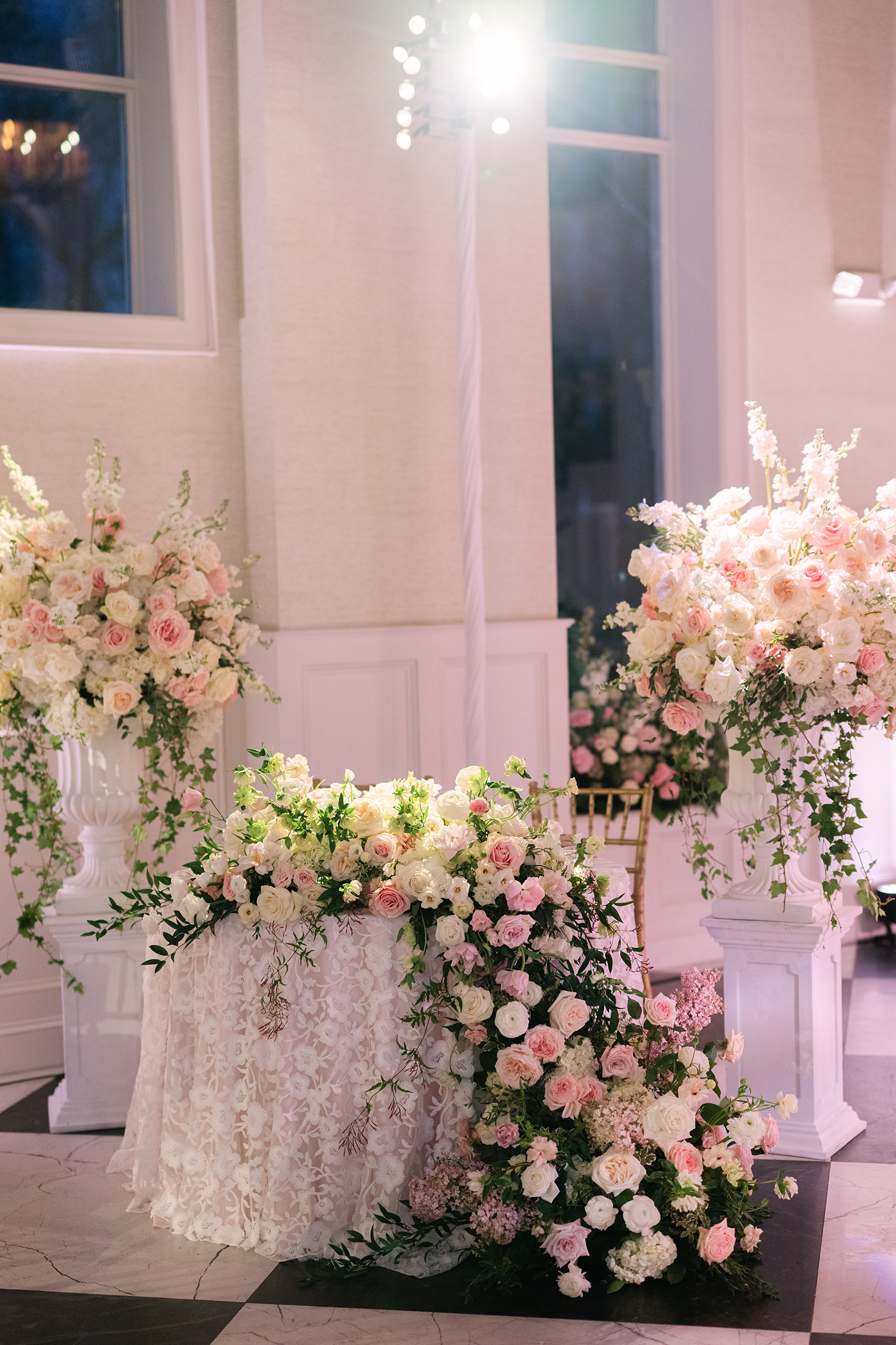 pink and white wedding reception decor with gold accents