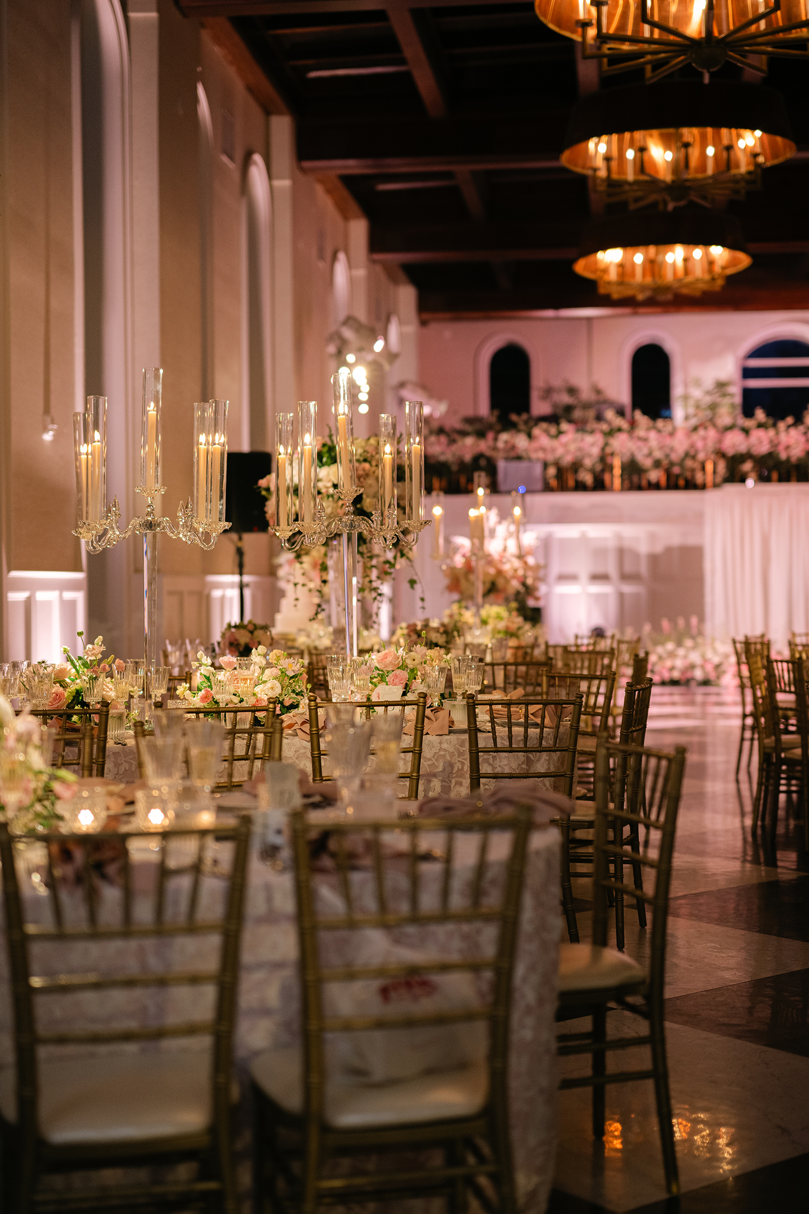 pink and white wedding reception decor with gold accents