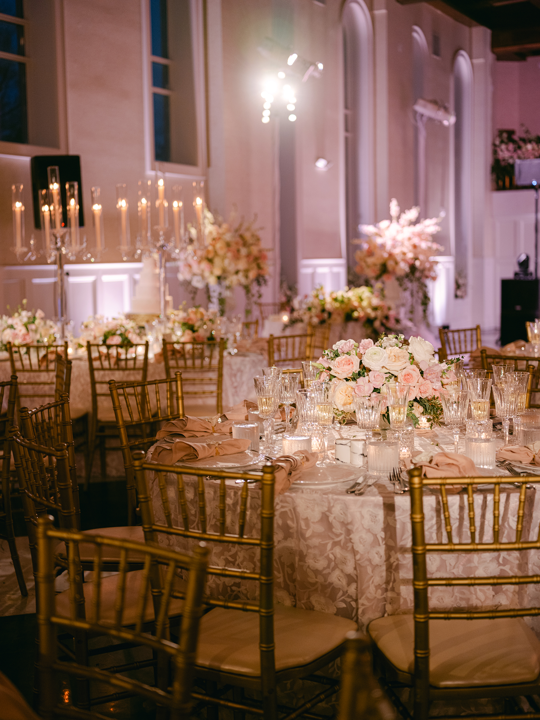 pink and white wedding reception decor with gold accents