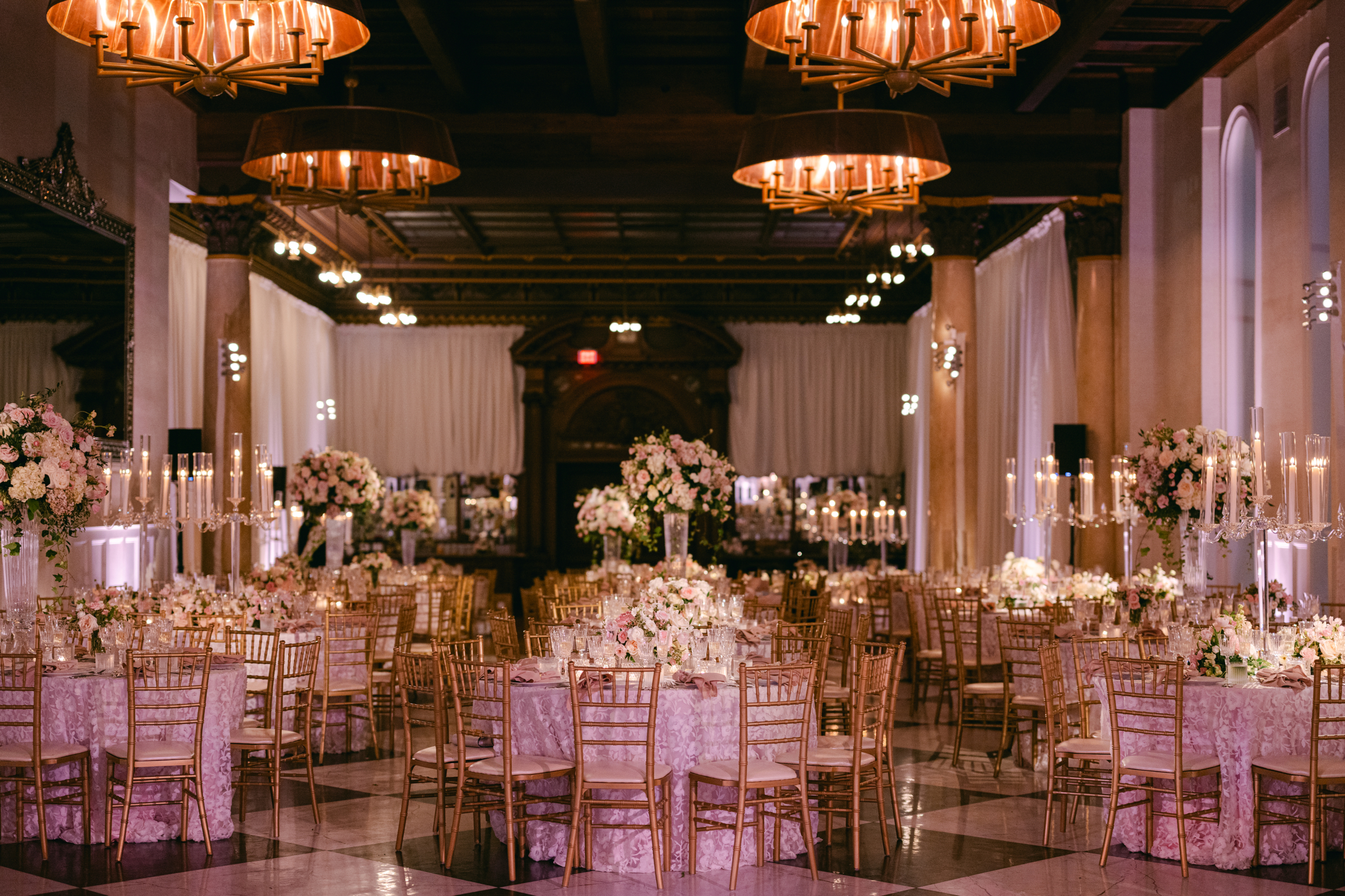 pink and white wedding reception decor with gold accents