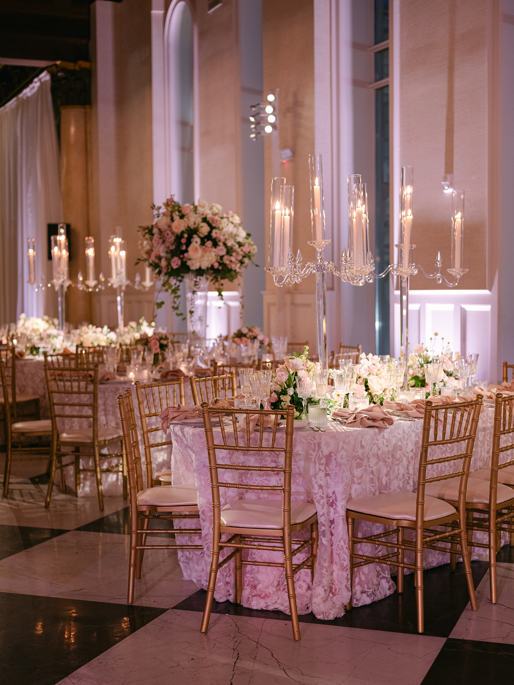 pink and white wedding reception decor with gold accents