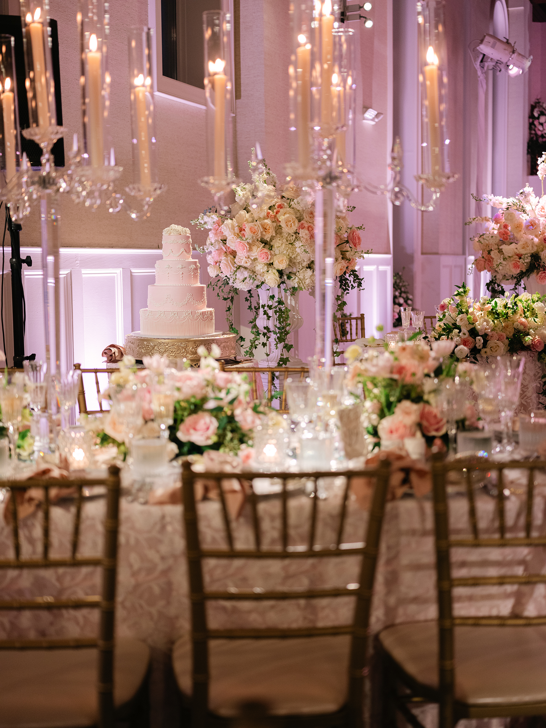 pink and white wedding reception decor with gold accents
