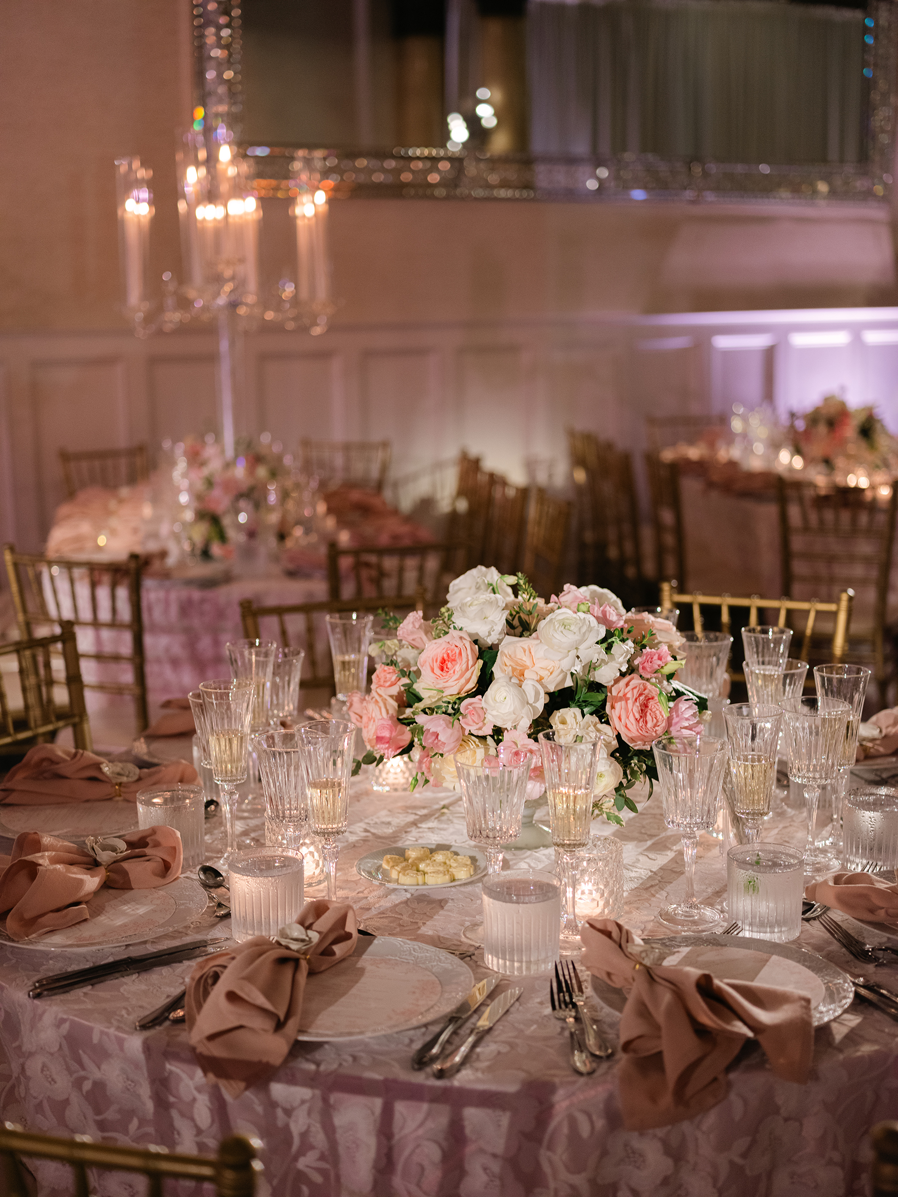 pink and white wedding reception decor with gold accents