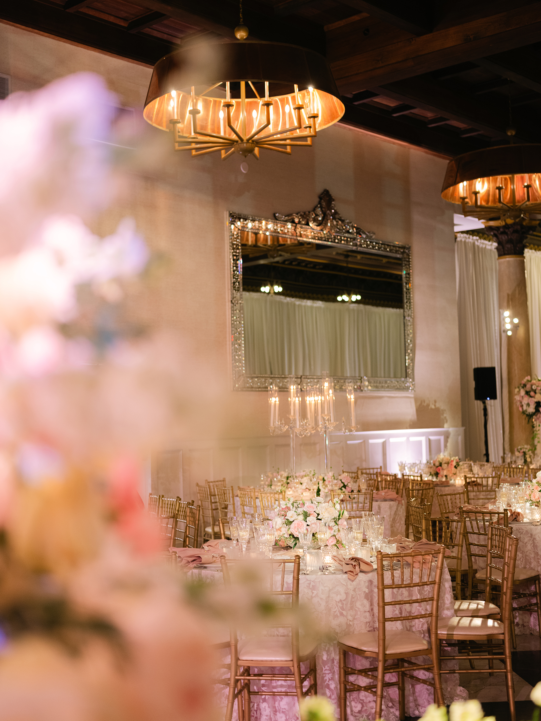 pink and white wedding reception decor with gold accents