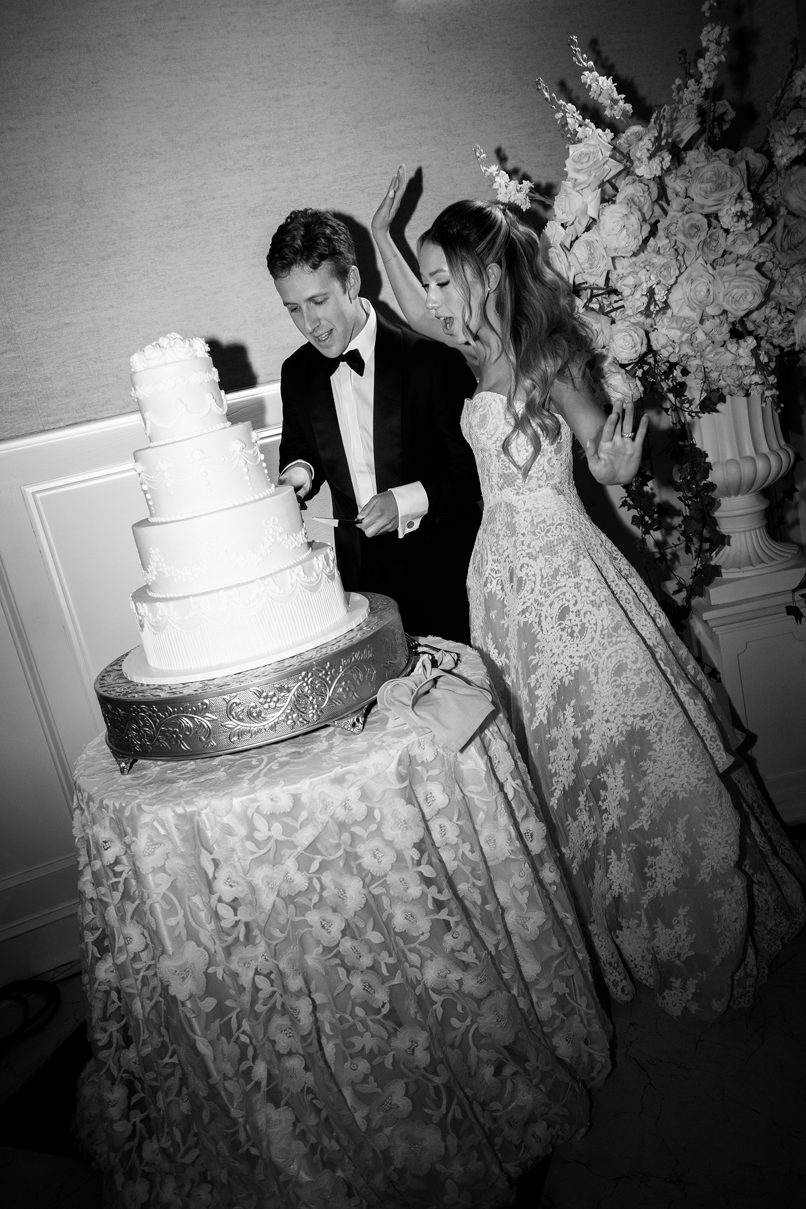bride and groom cutting wedding cake