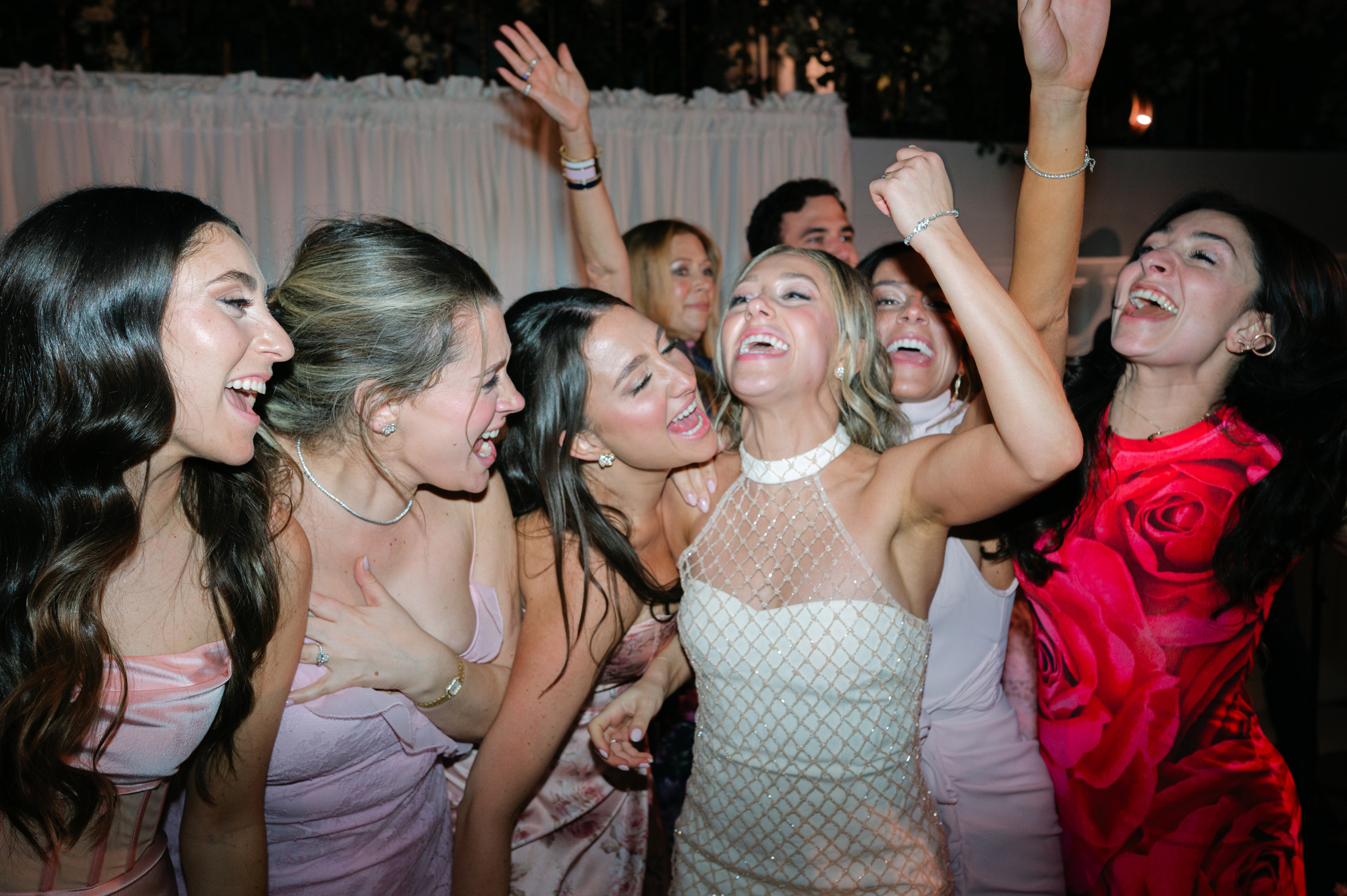 bride with bridesmaids during wedding reception