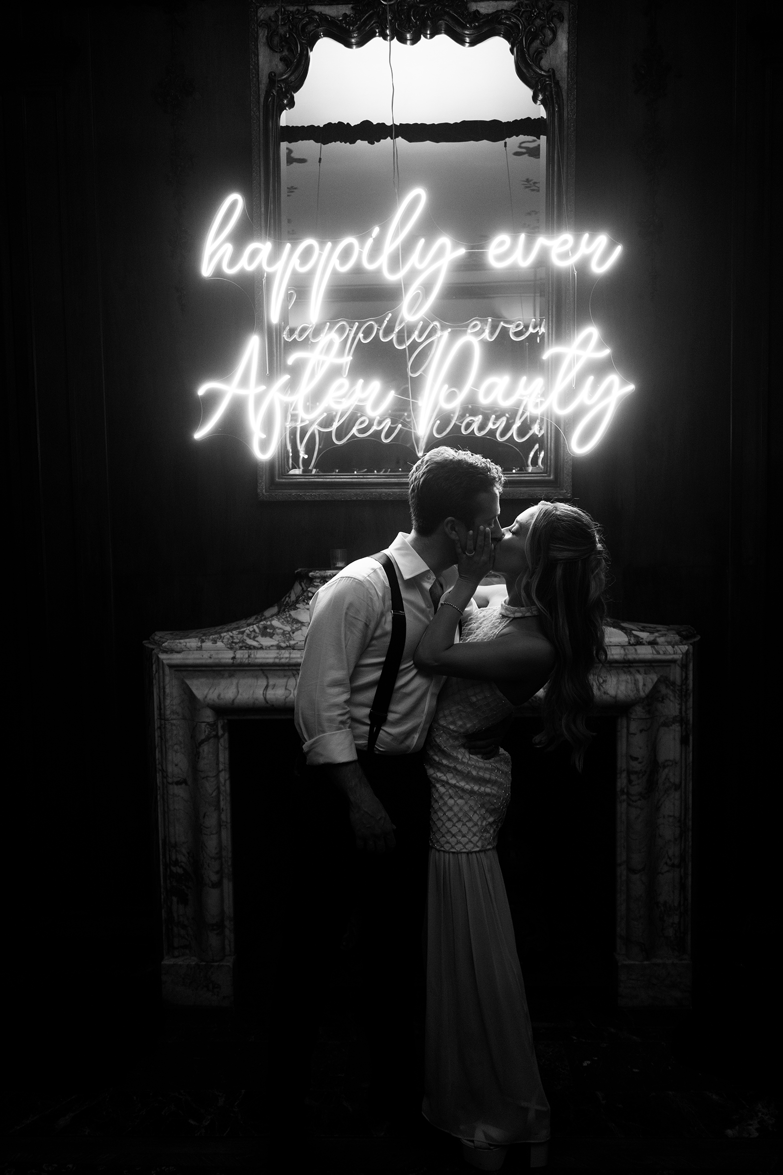 bride and groom in front of LED lights during wedding reception