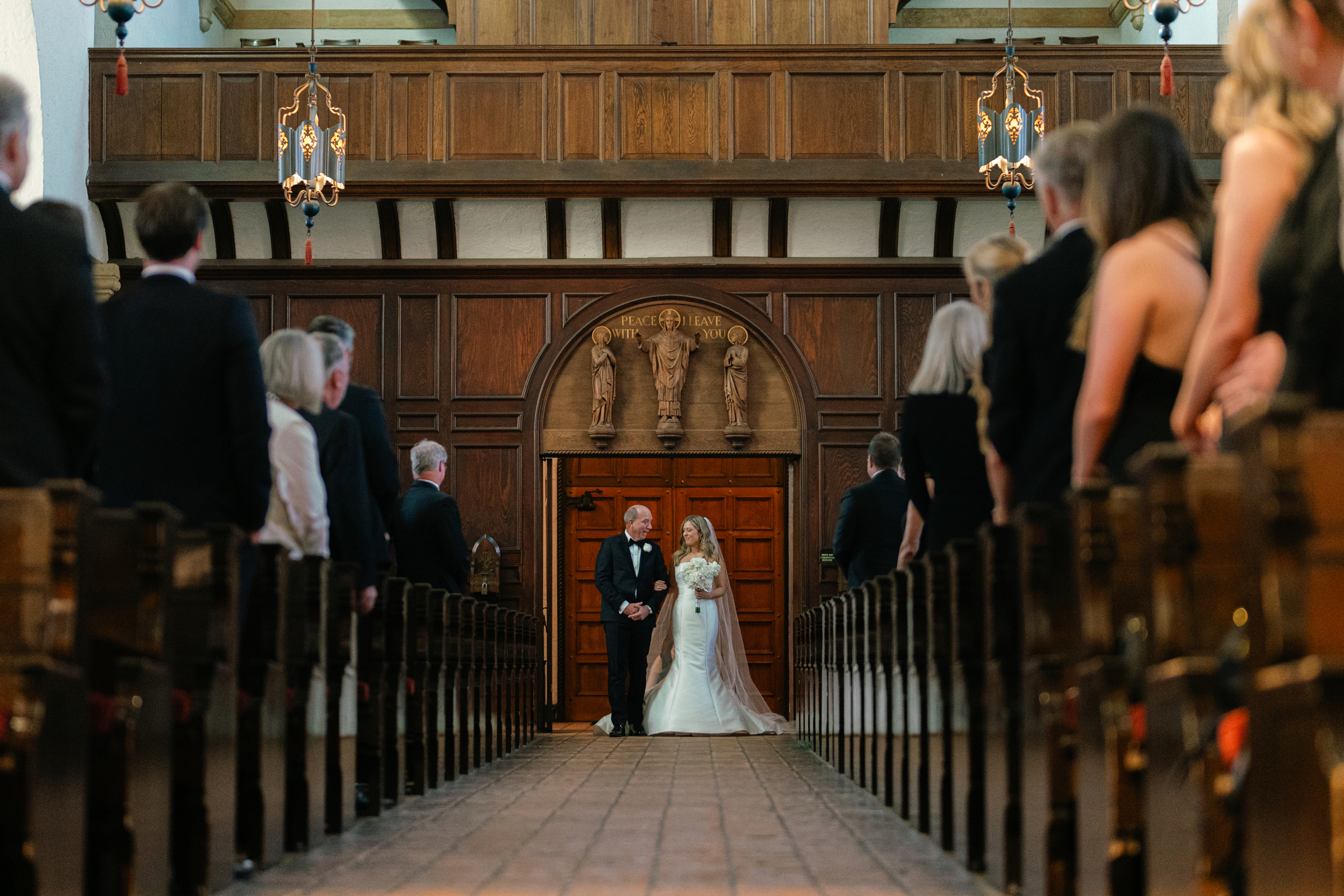bride entering wedding ceremony with dad