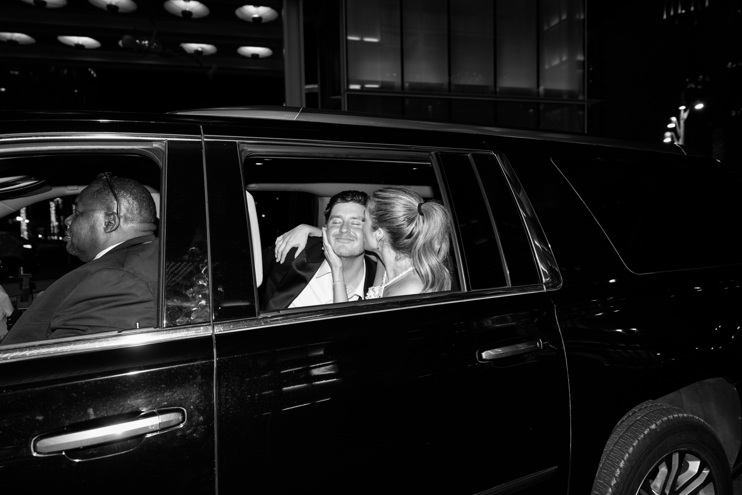 black and white picture of bride and groom exiting