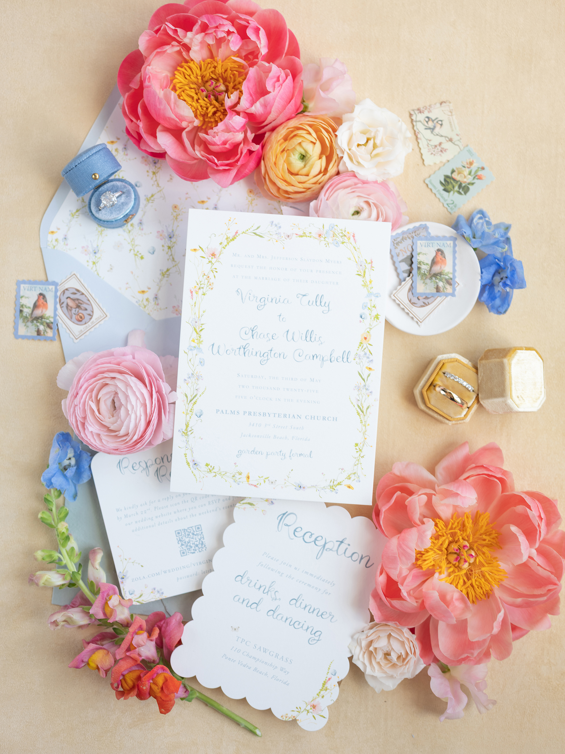 wedding flat lay with pink, blue, yellow