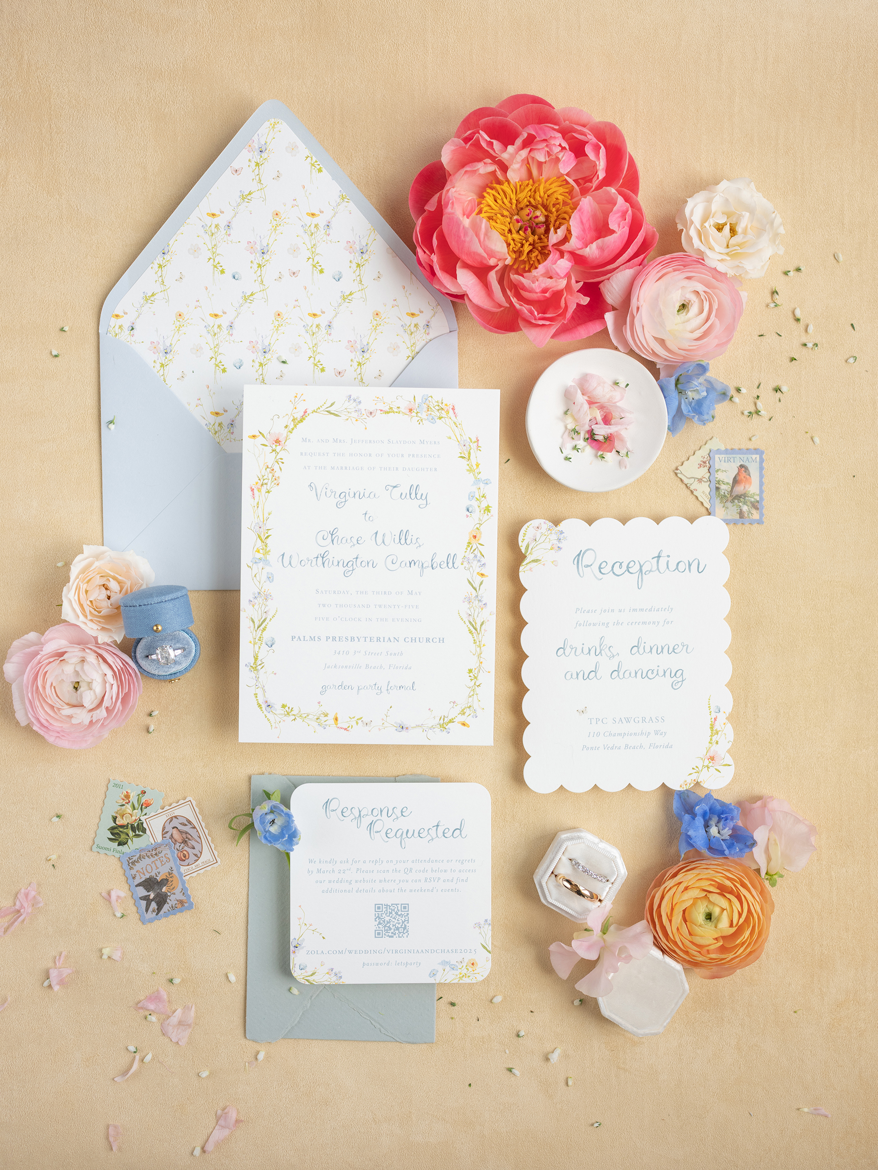 wedding flat lay with pink, blue, yellow