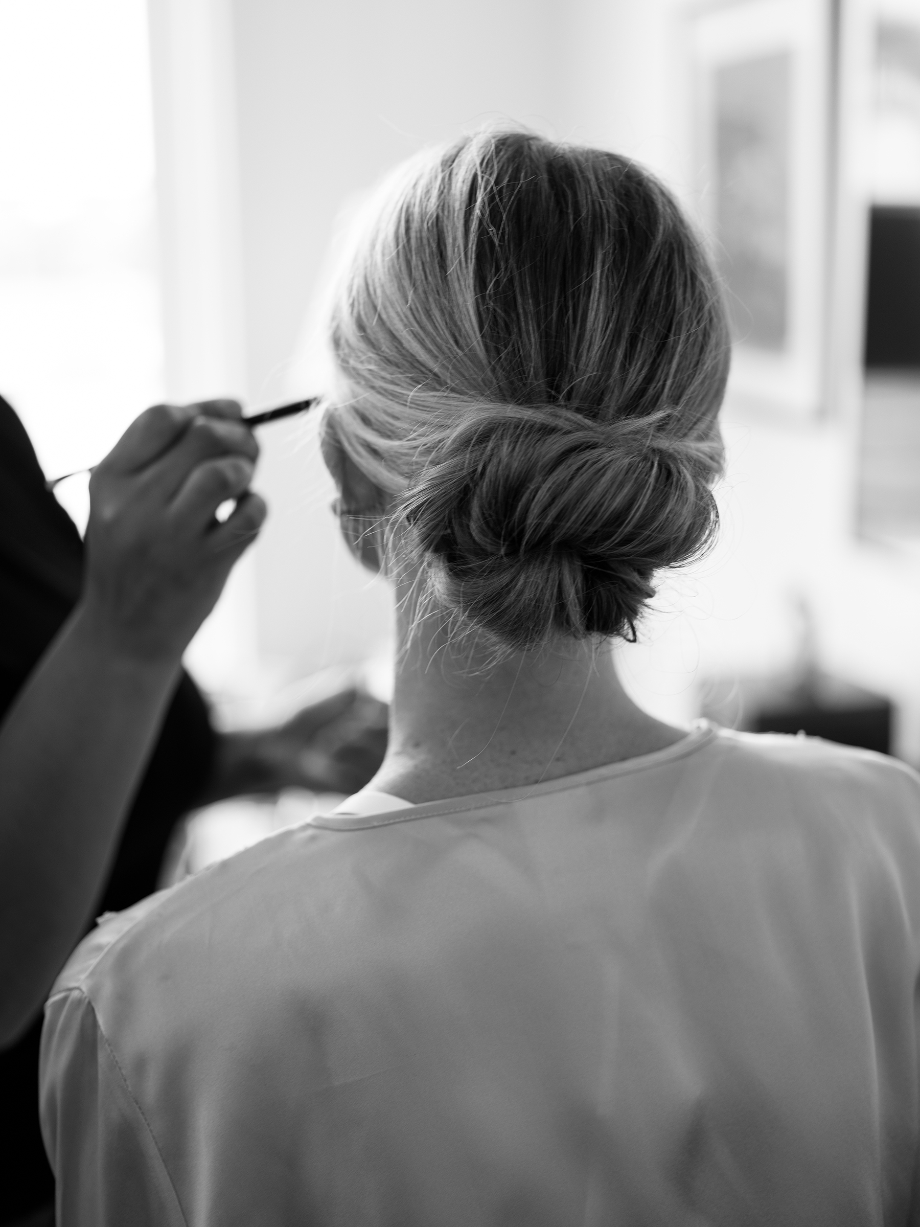 black and white picture of bride's hair in updo