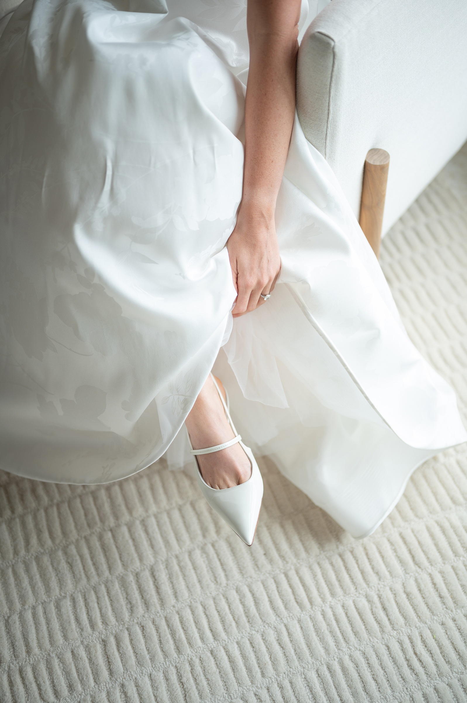 close-up of wedding shoes and dress