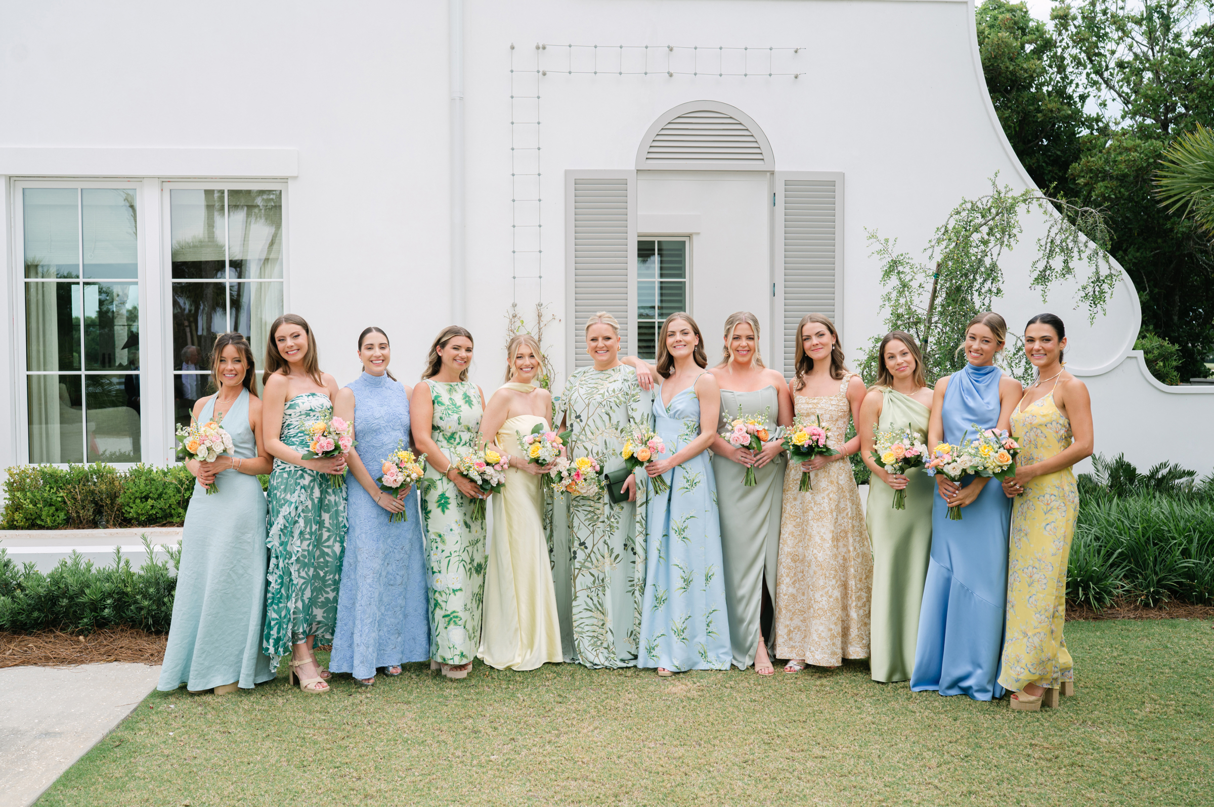 floral, yellow, green, blue bridesmaids' dresses with colorful bouquets