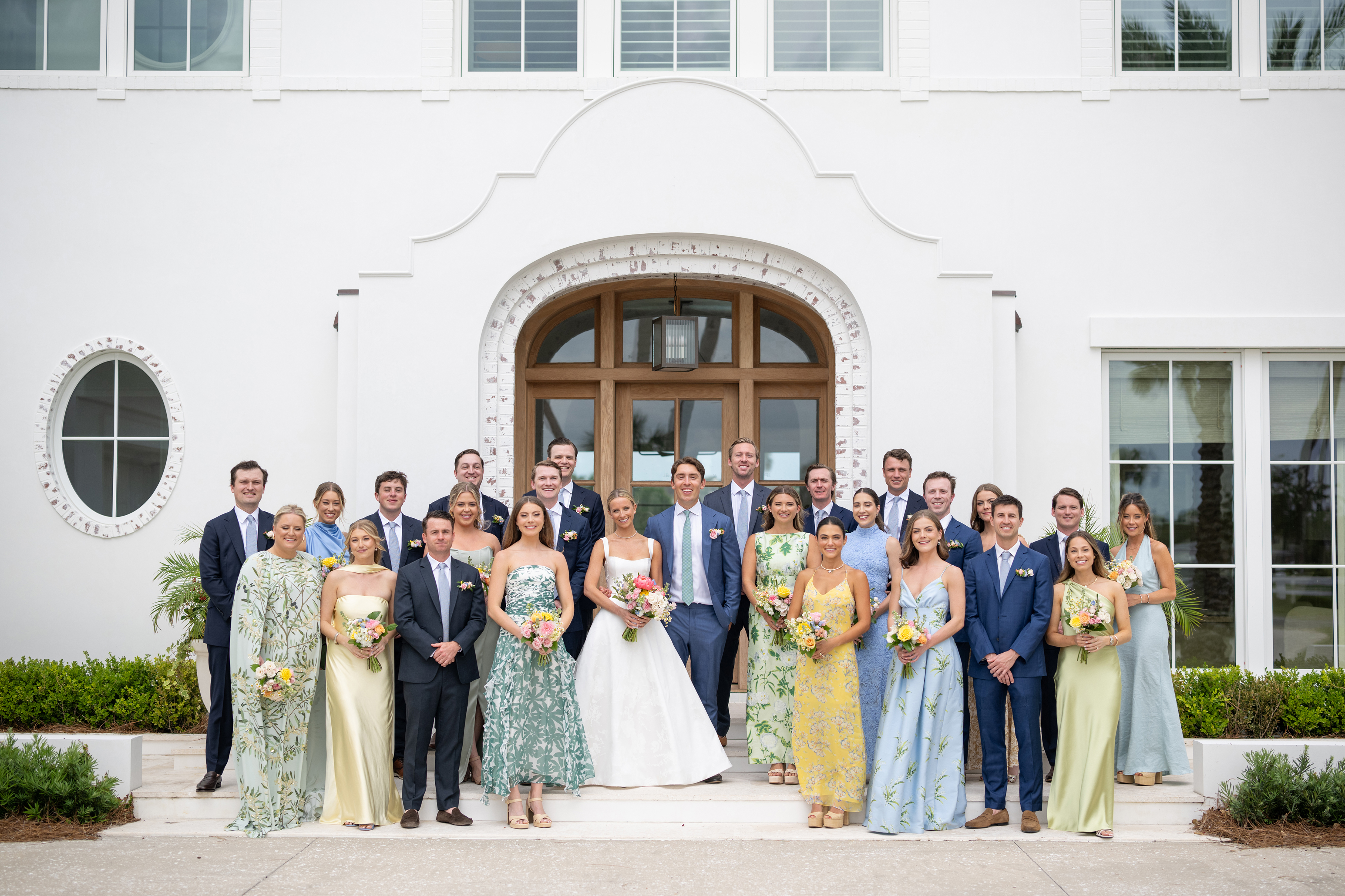 wedding party in florals, blues, greens, yellows