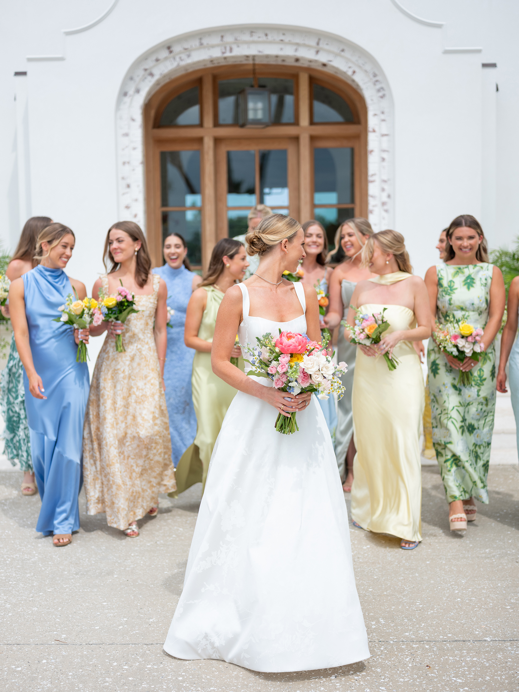 bride walking with bridesmaids