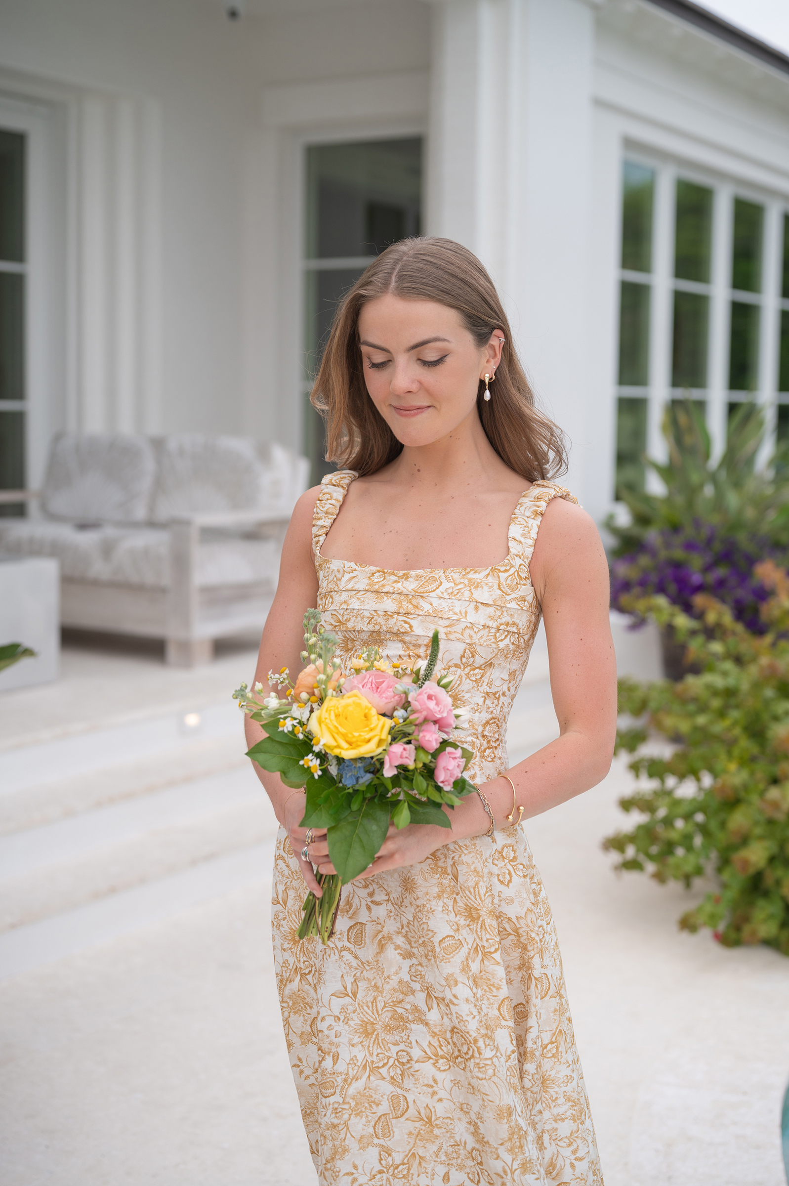 beige floral bridesmaid's dress with colorful bouquet