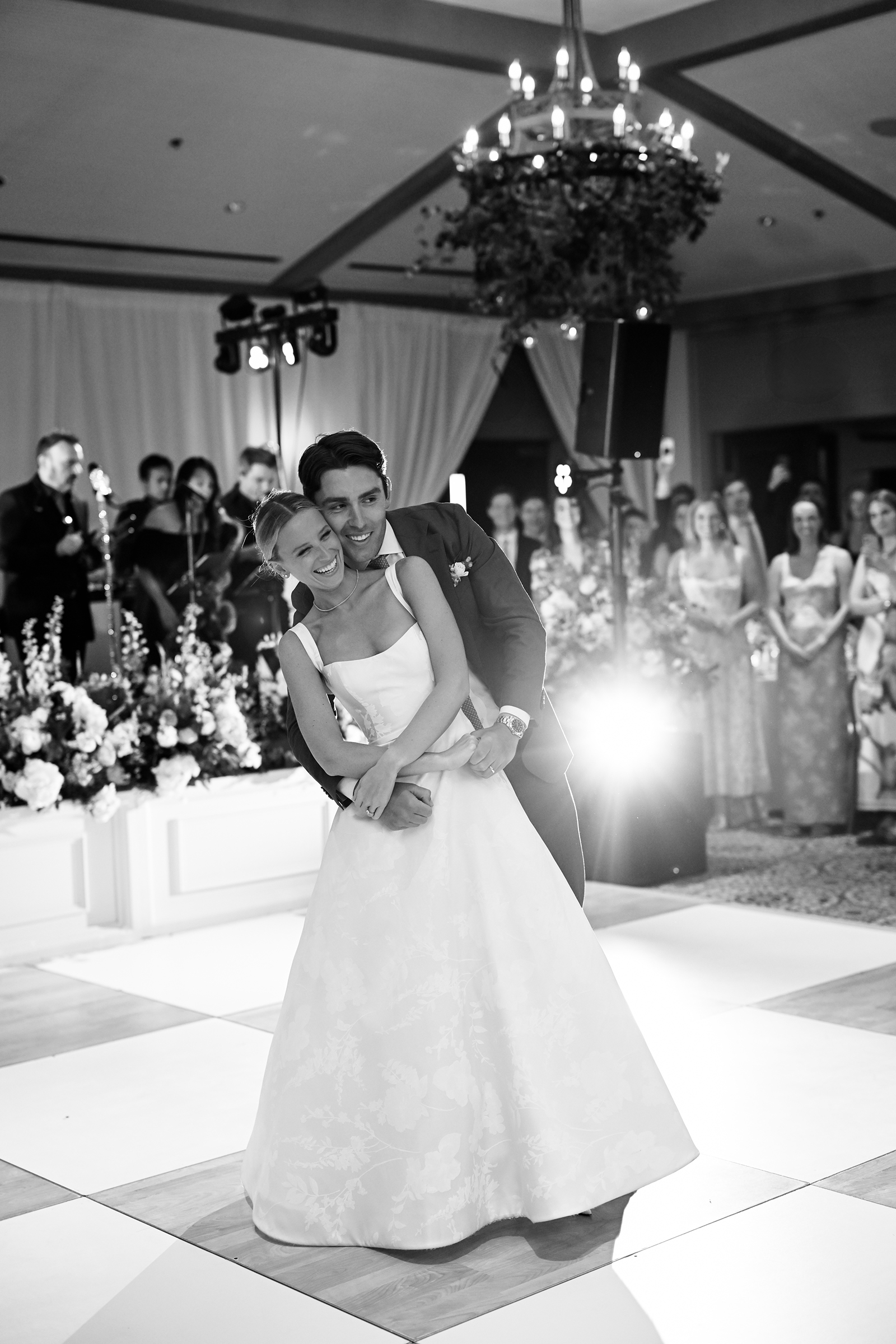 black and white picture of bride and groom during first dance