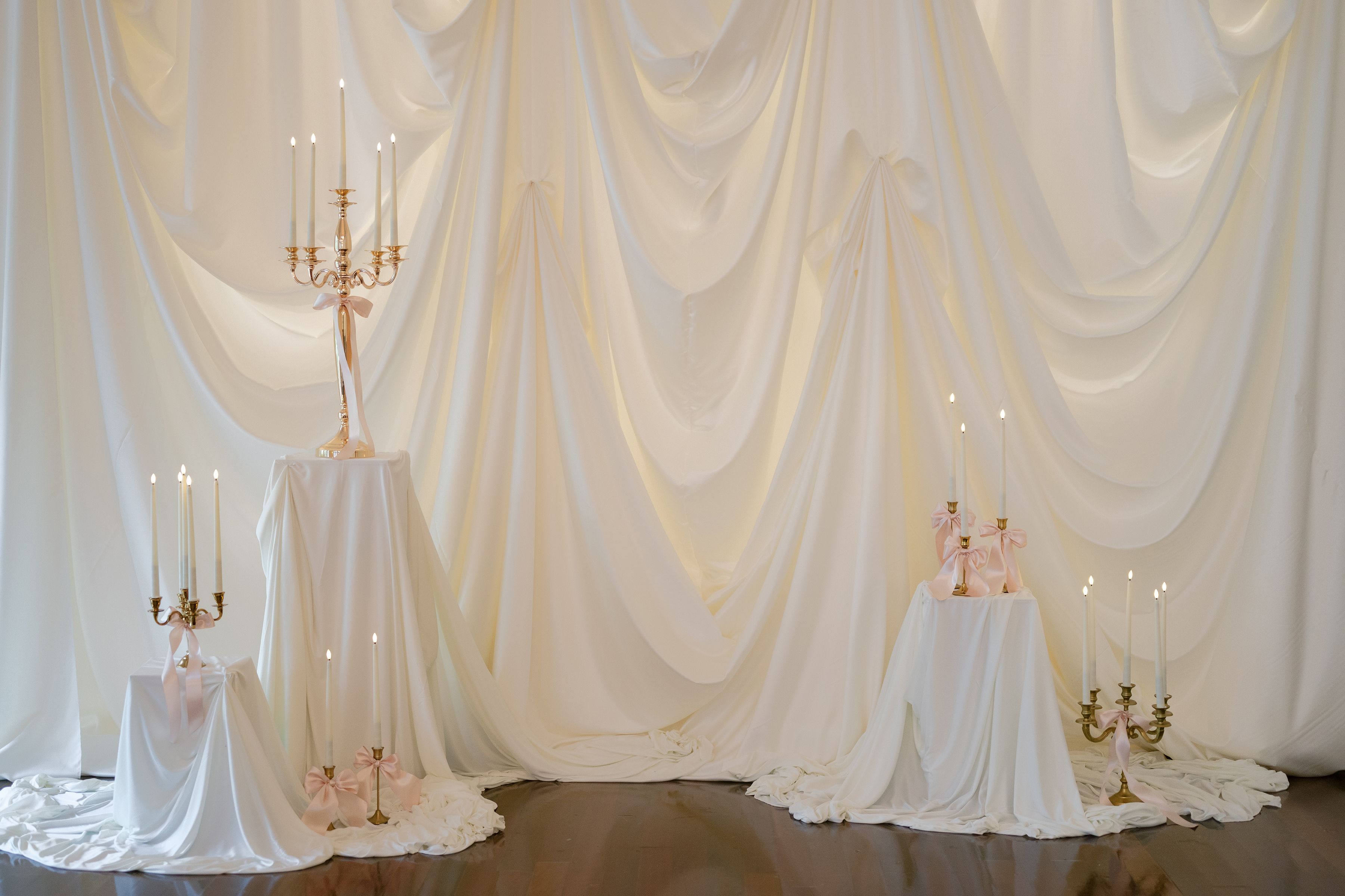 wedding ceremony decor with linen drapings and candles