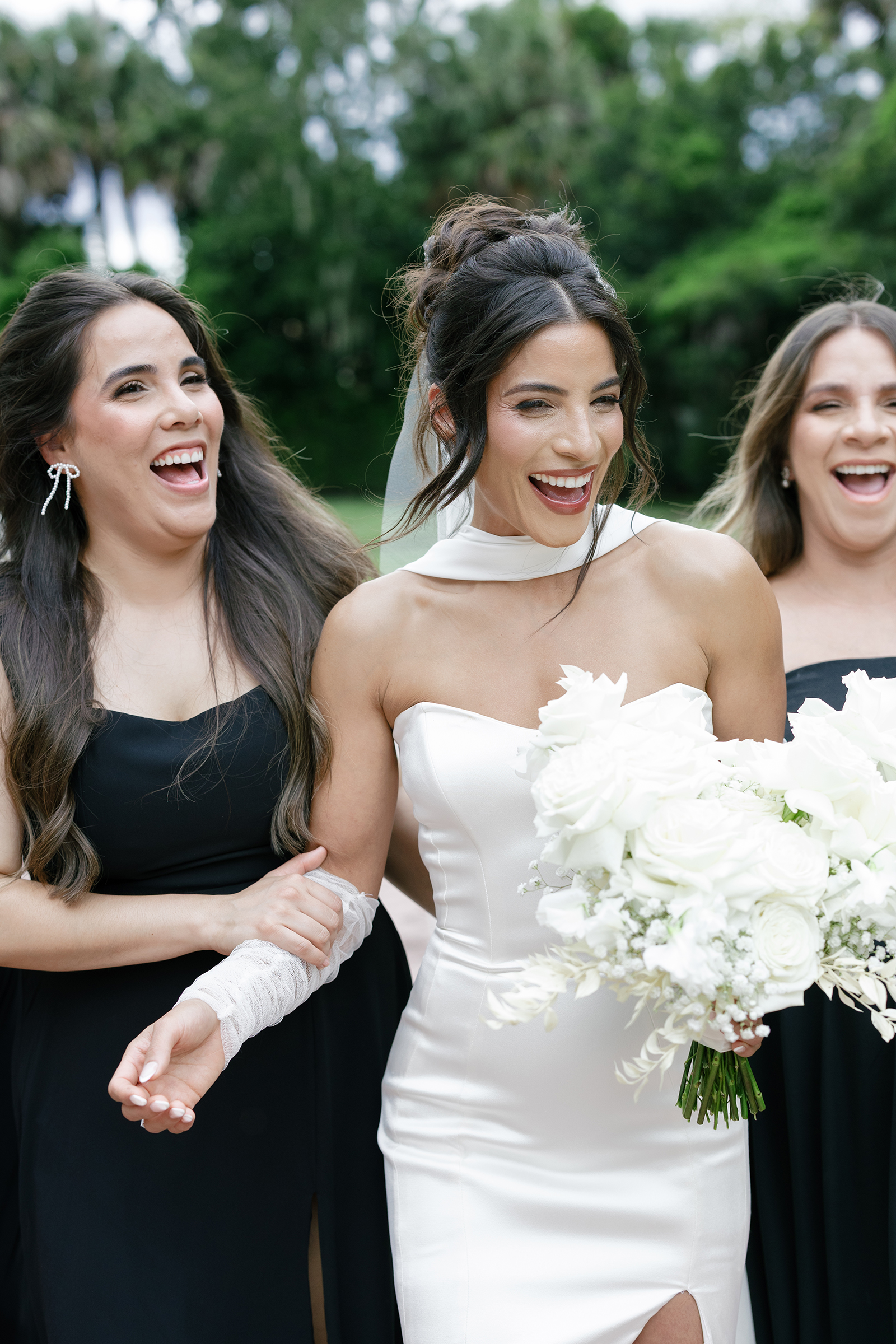 bride with bridesmaids in black dresses