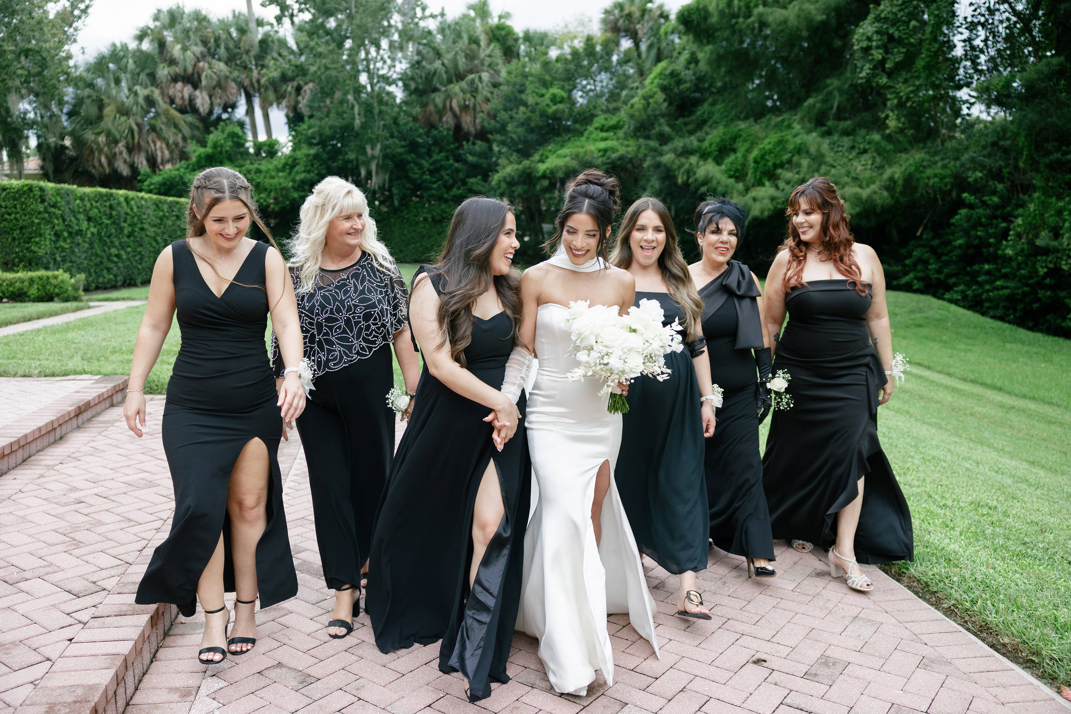 bride with bridesmaids in black dresses