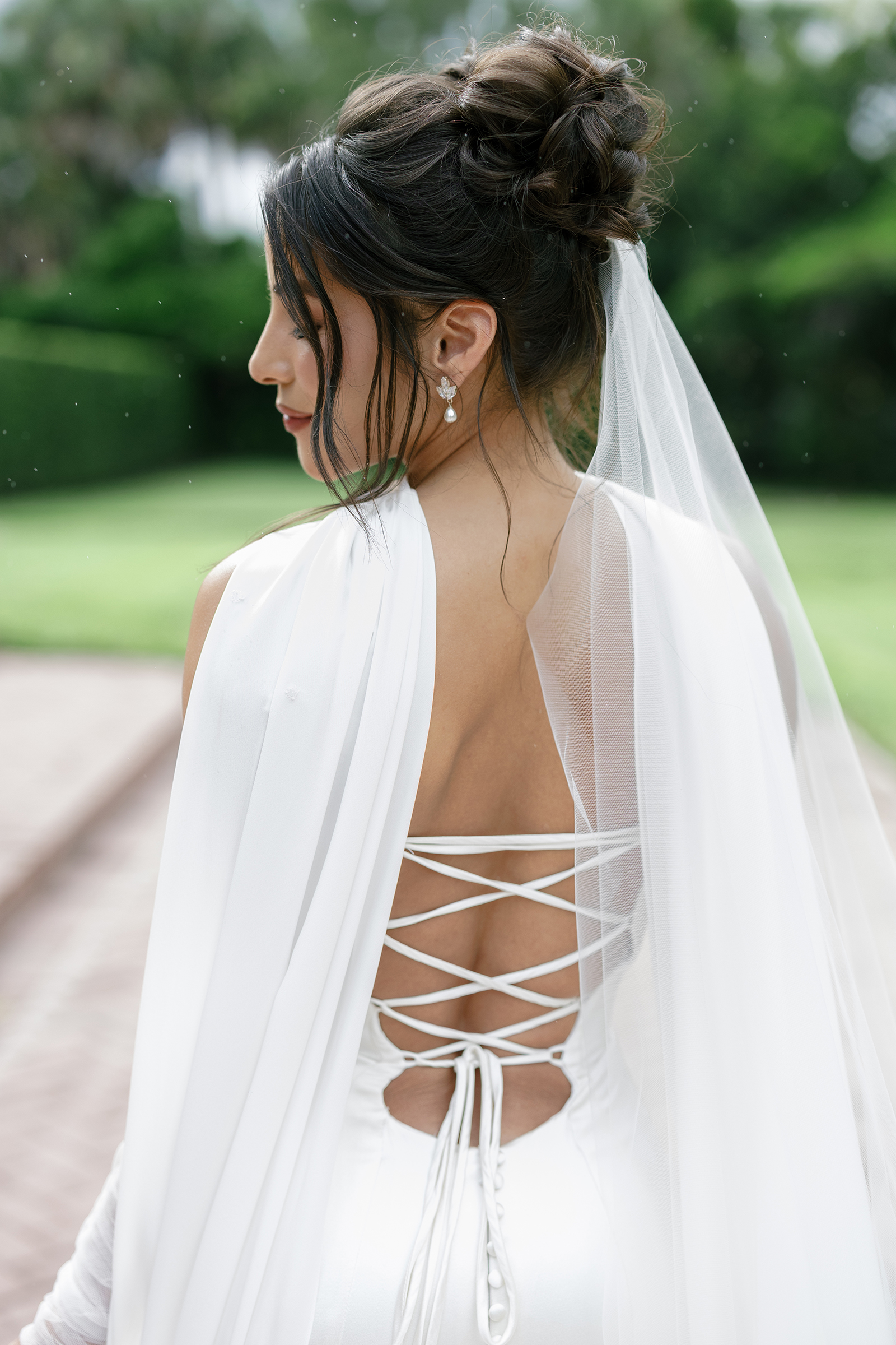 picture of bride with classic corset wedding dress and open back details