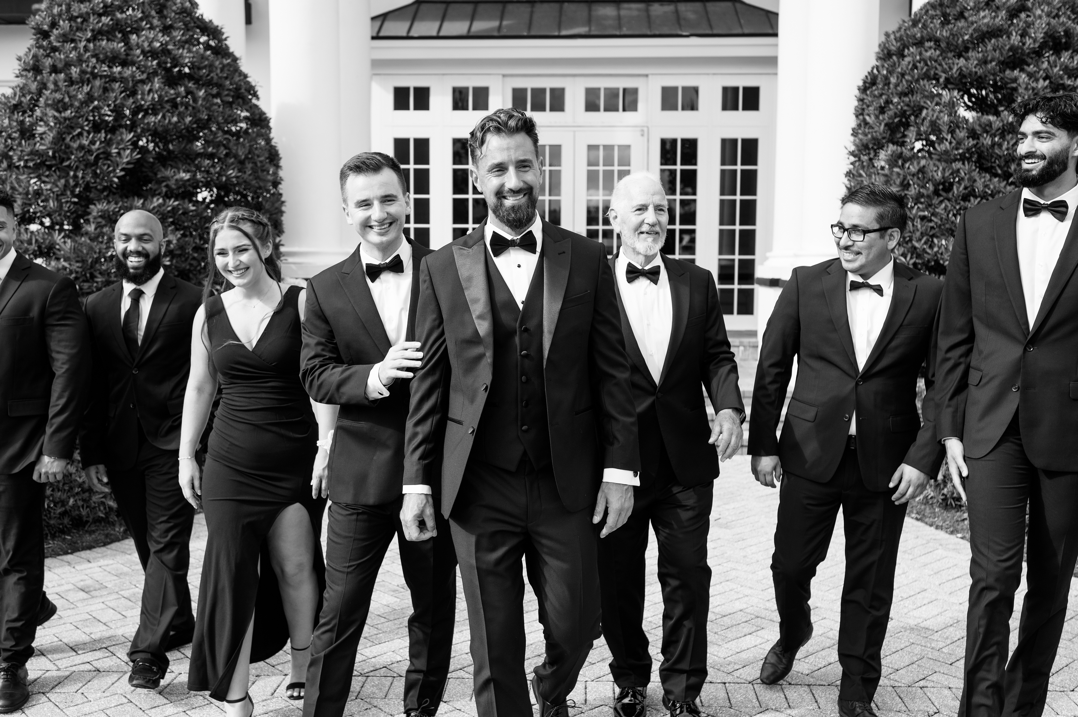 black and white picture of groom with groomsmen