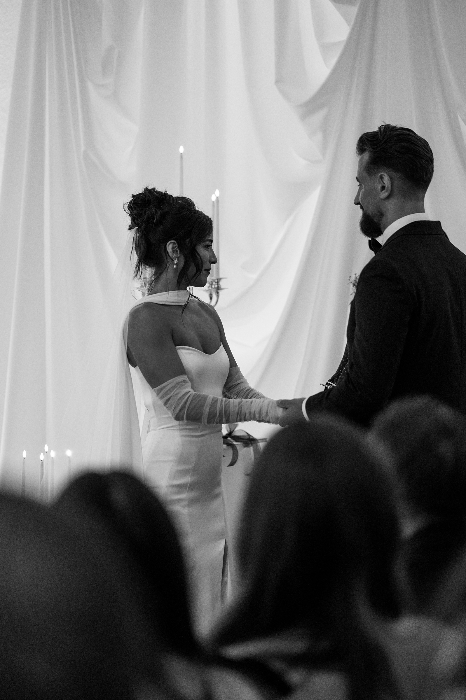 black and white picture of bride and groom during wedding ceremony